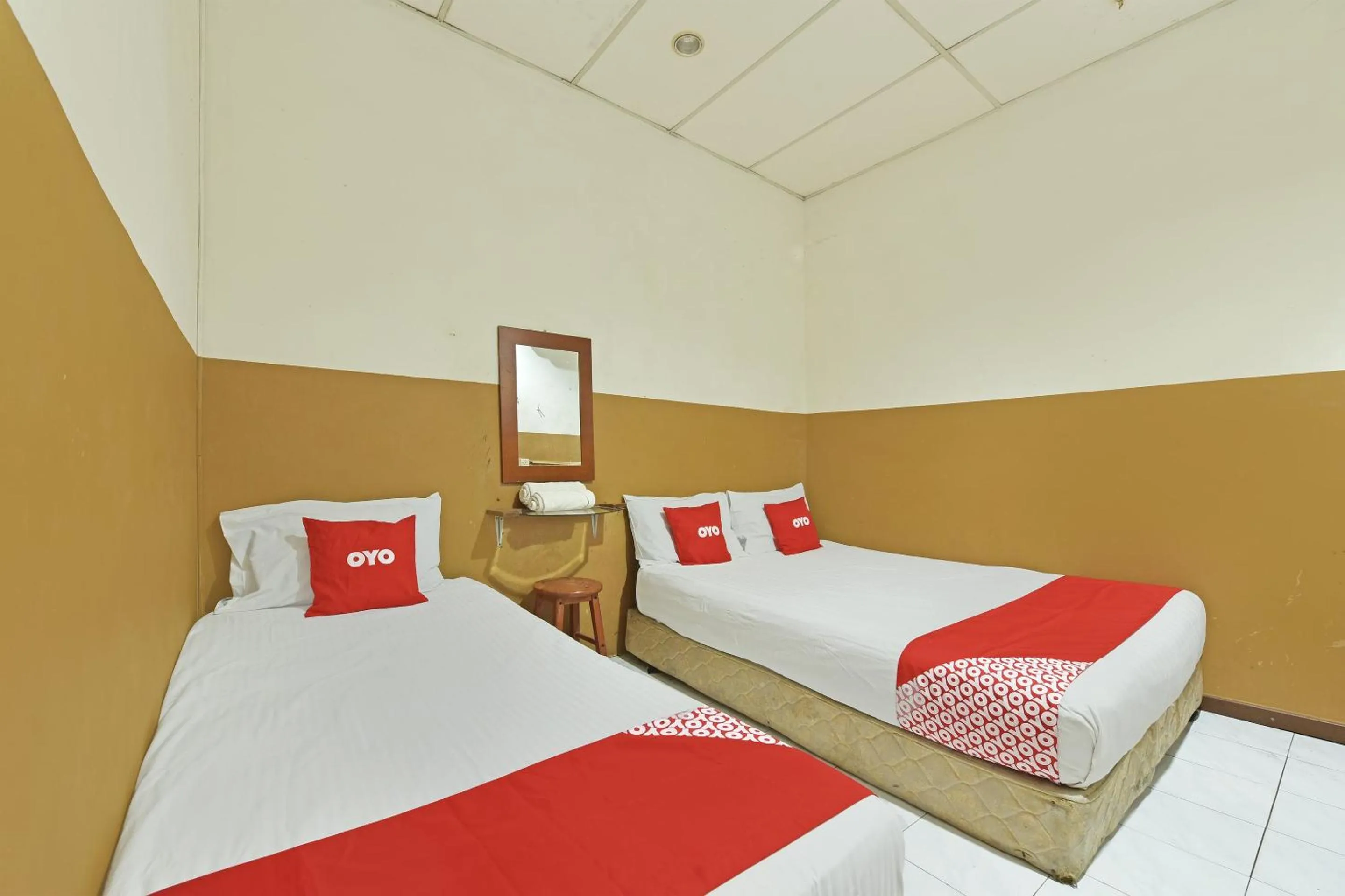 Bedroom in OYO 90794 Maple Hotel