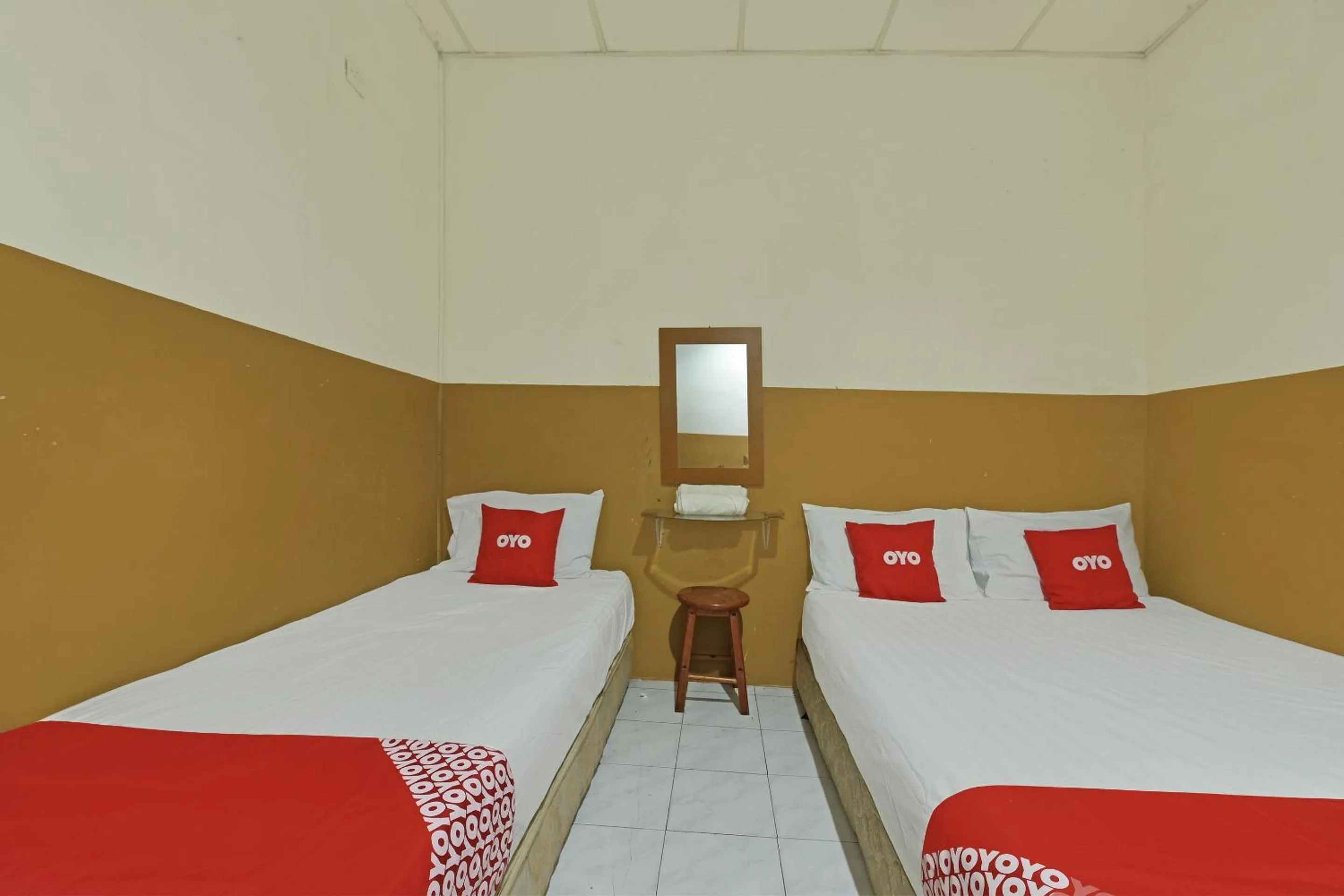 Bedroom in OYO 90794 Maple Hotel