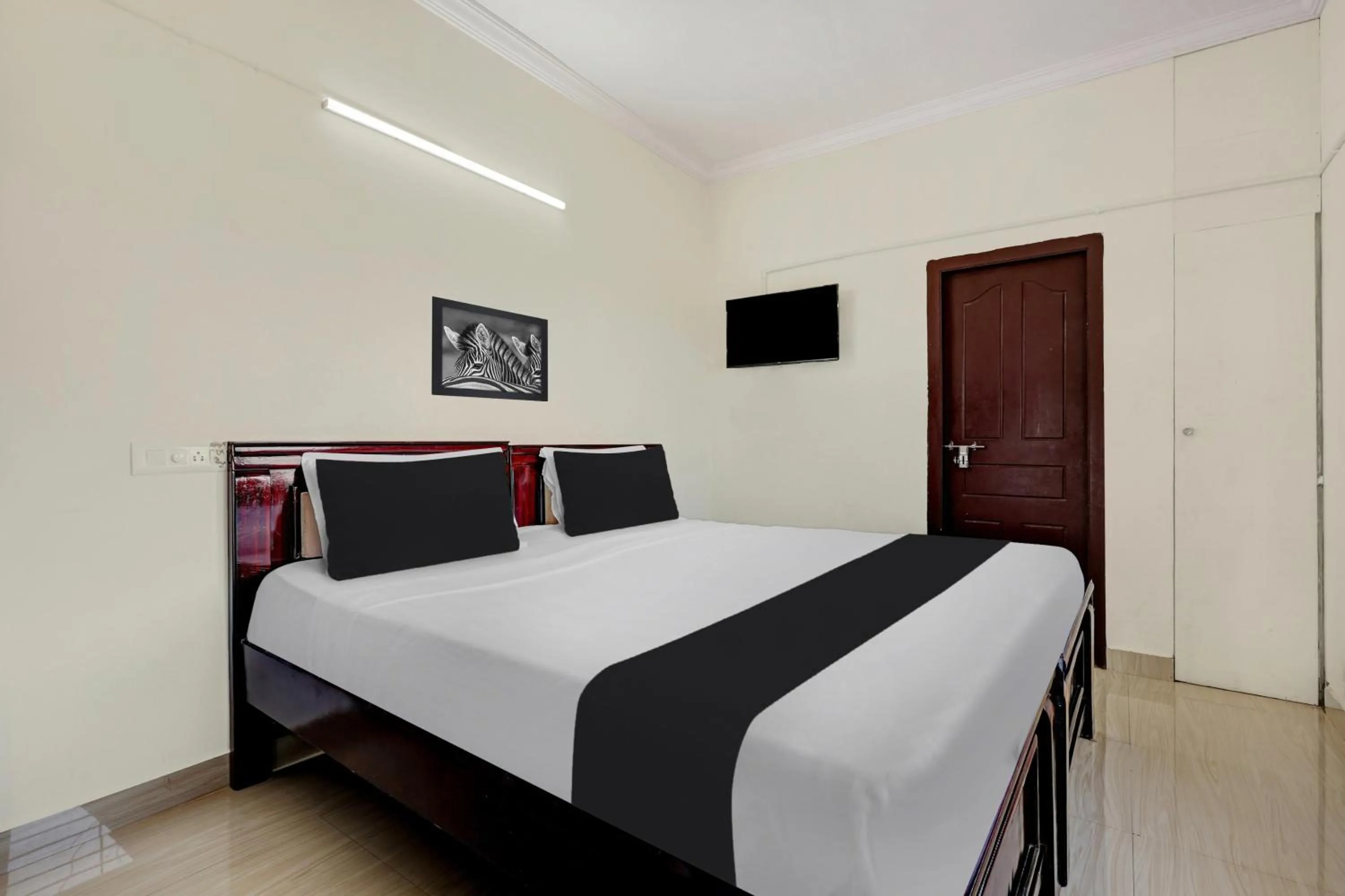 Bedroom, Bed in Super Hotel O Ramaraopet Near Kakinada Beach