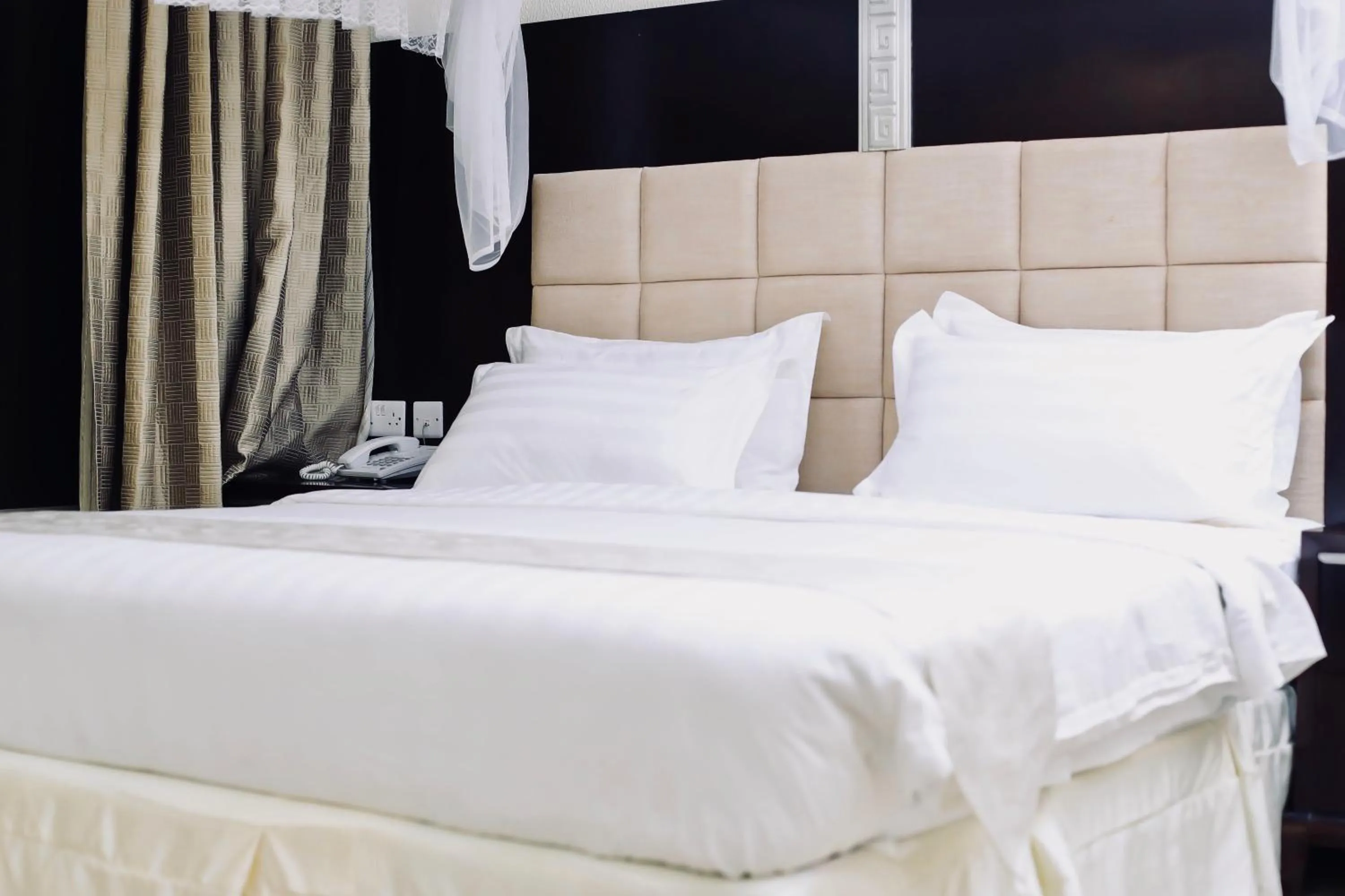 Bed in Landmark Mbezi Beach Resort