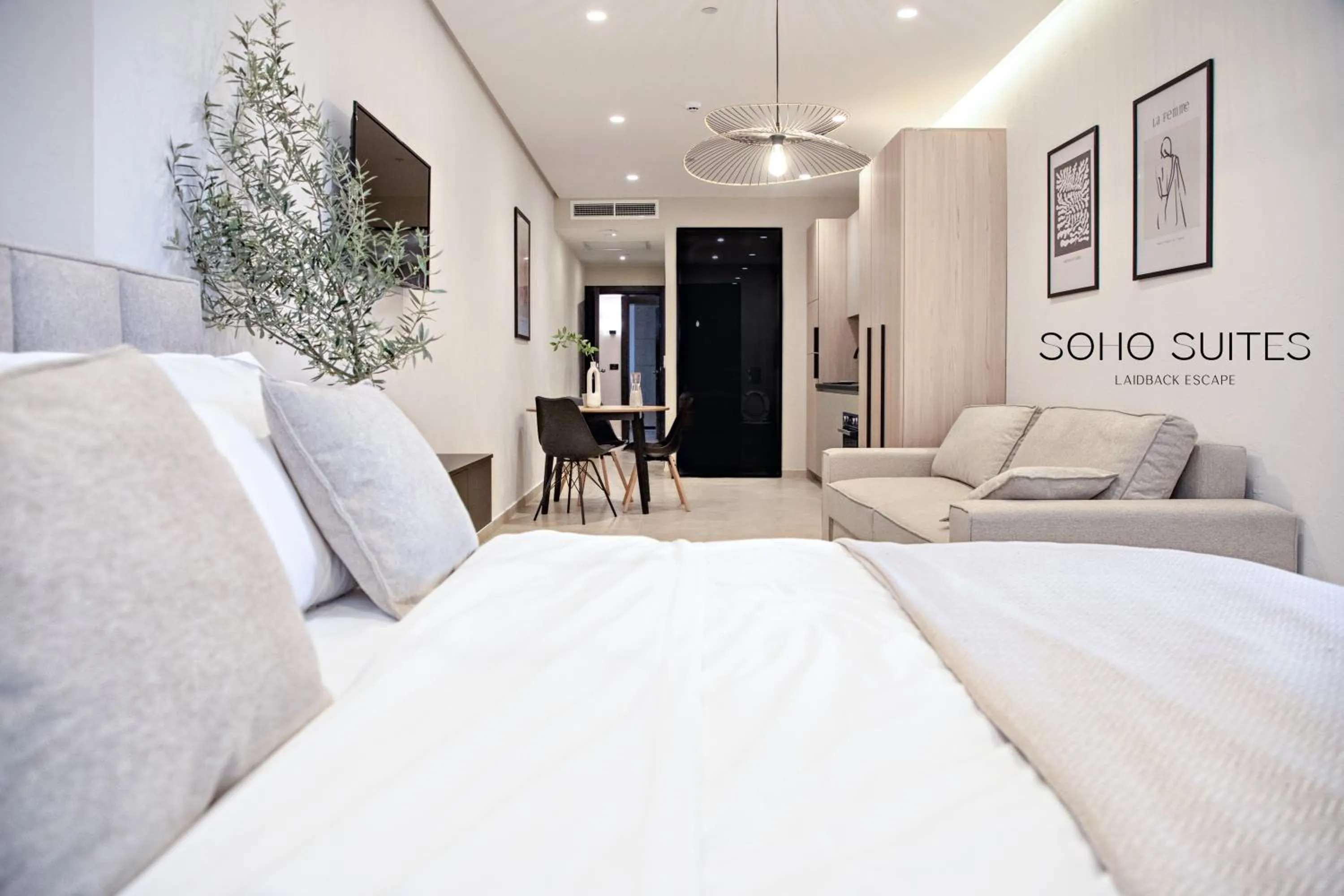 Photo of the whole room, Bed in Soho Suites