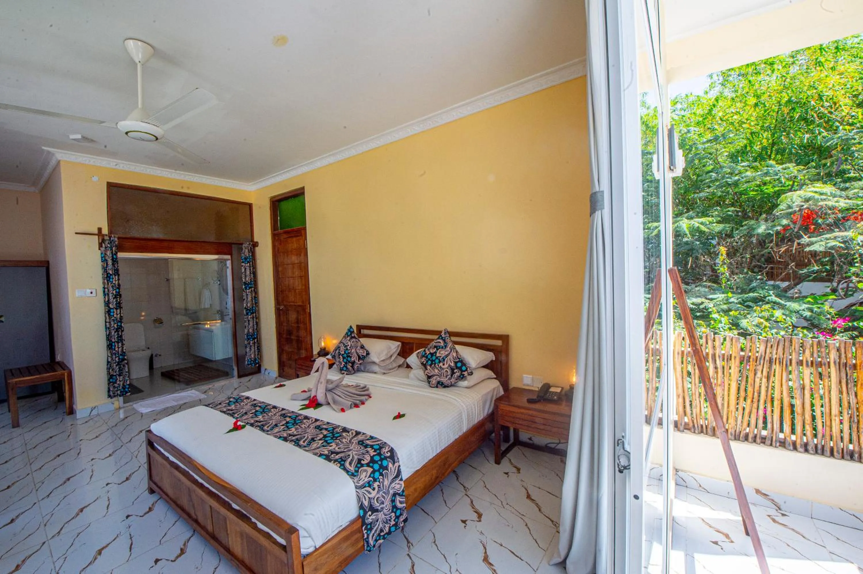 Bed in Double A Nungwi Beach Hotel