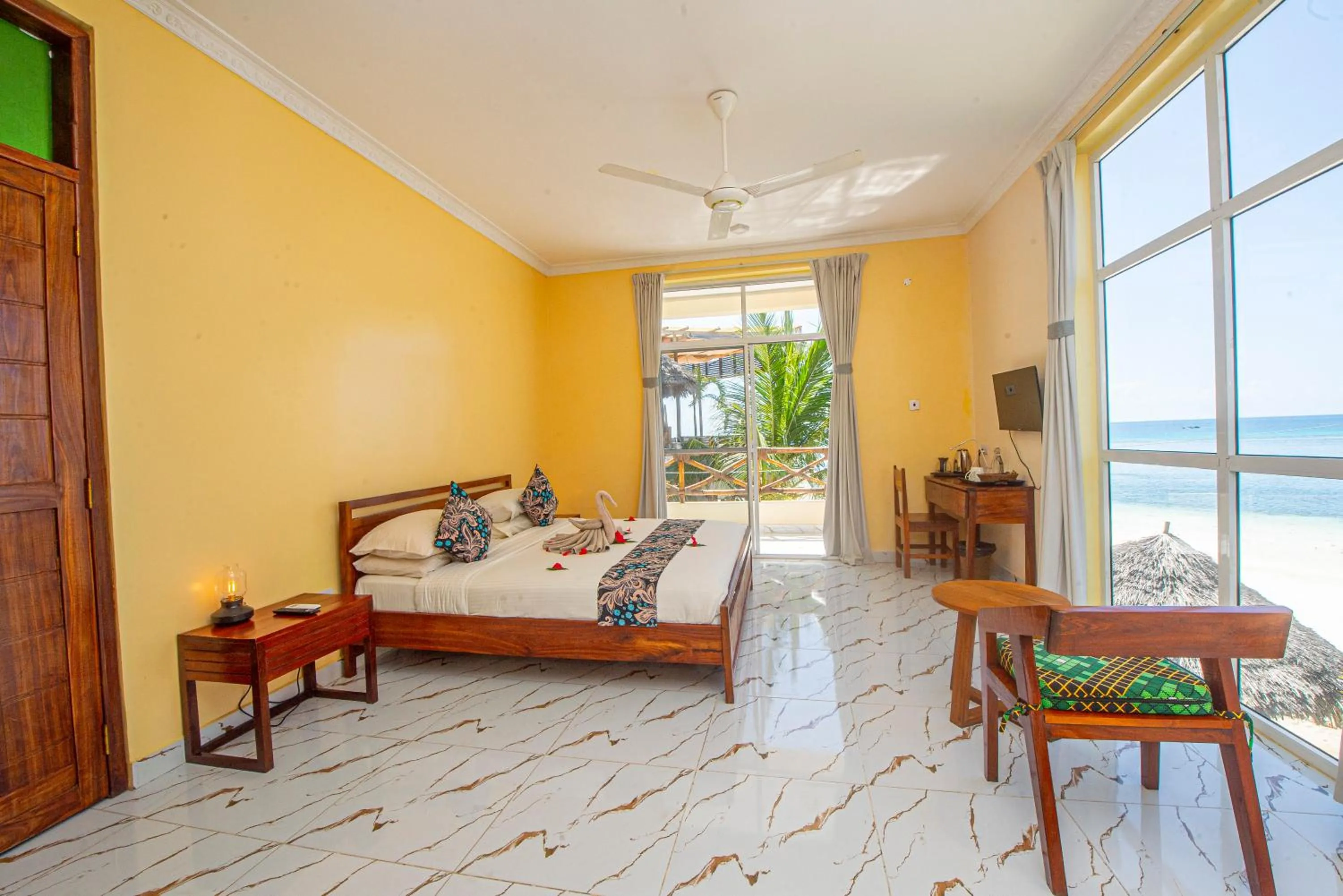 Bed in Double A Nungwi Beach Hotel