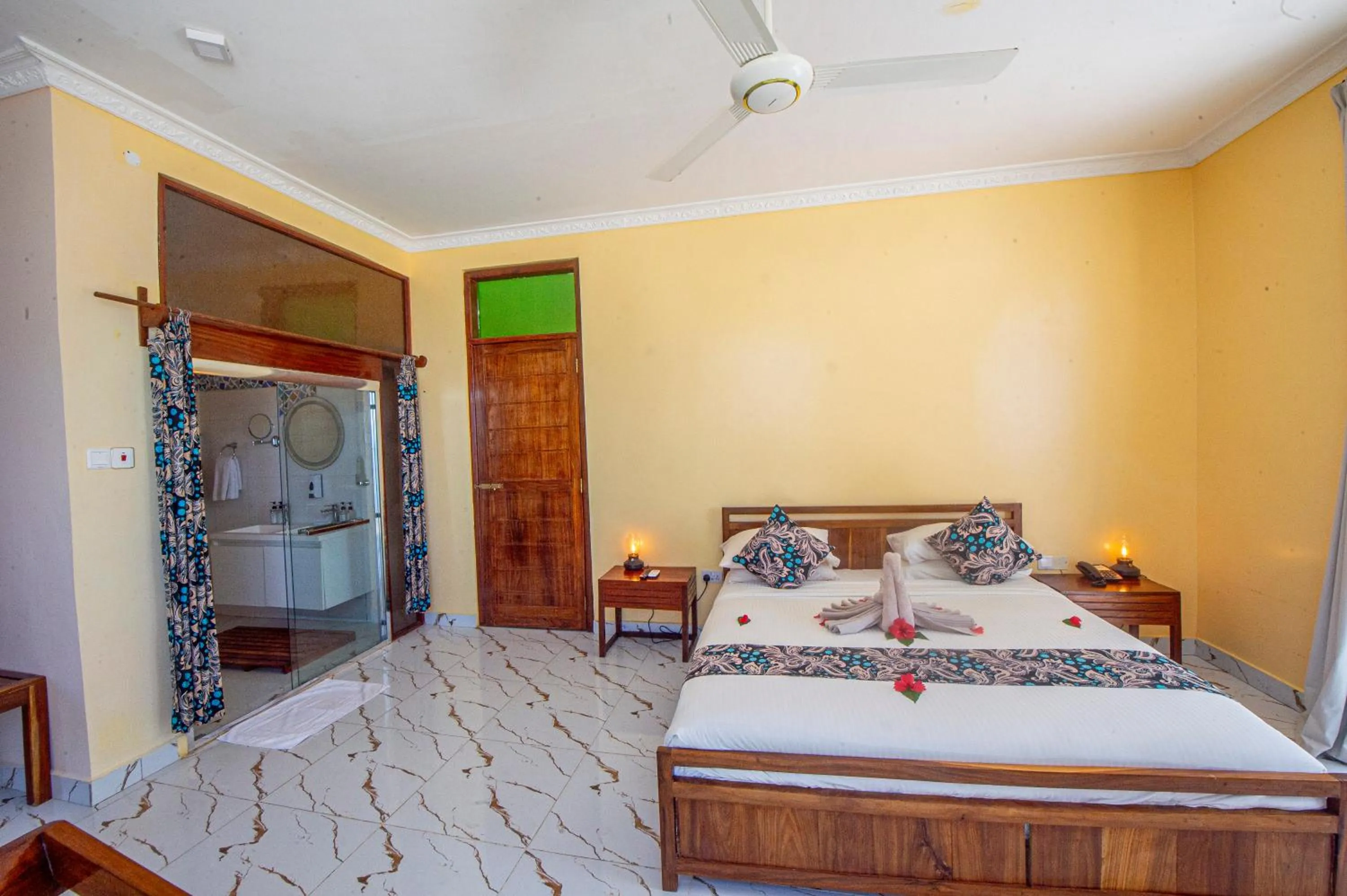 Bed in Double A Nungwi Beach Hotel