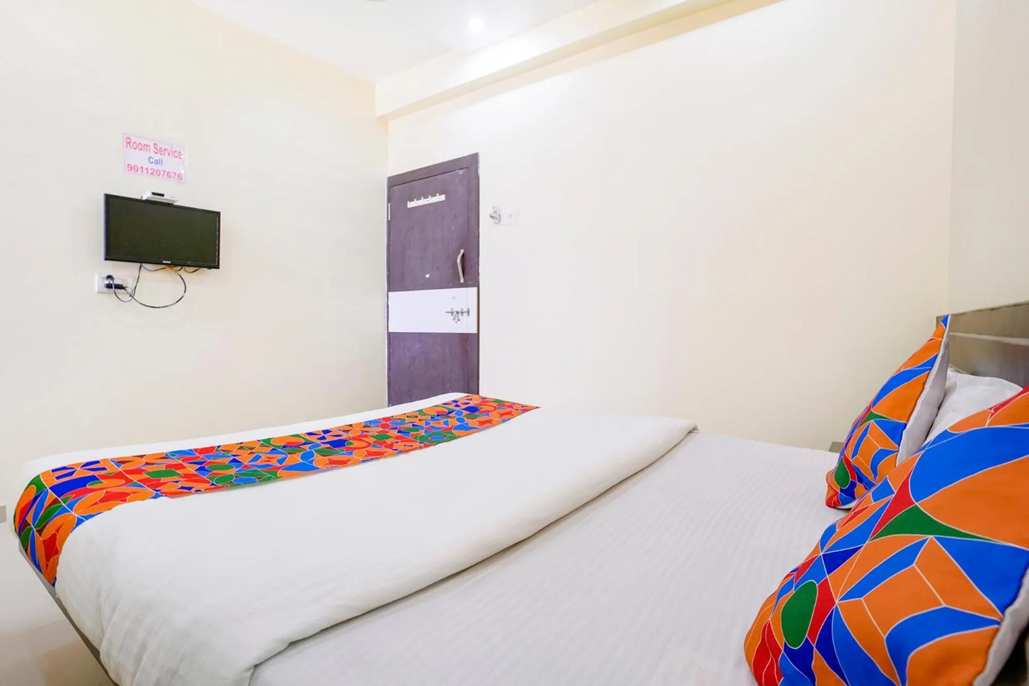 Communal lounge/ TV room, Bed in FabHotel Sai Govind