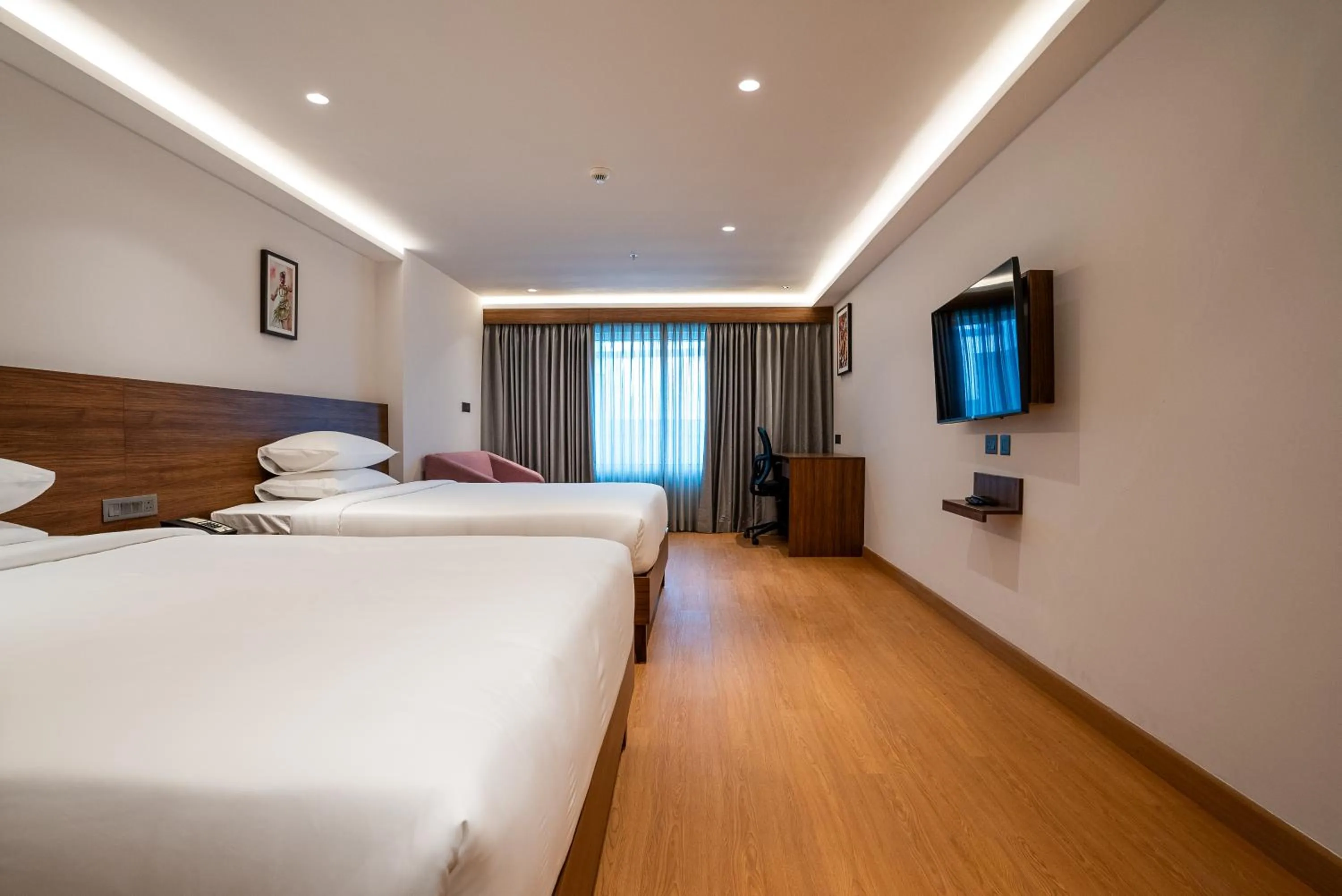 Bed in Lilac Hotel Guruvayur