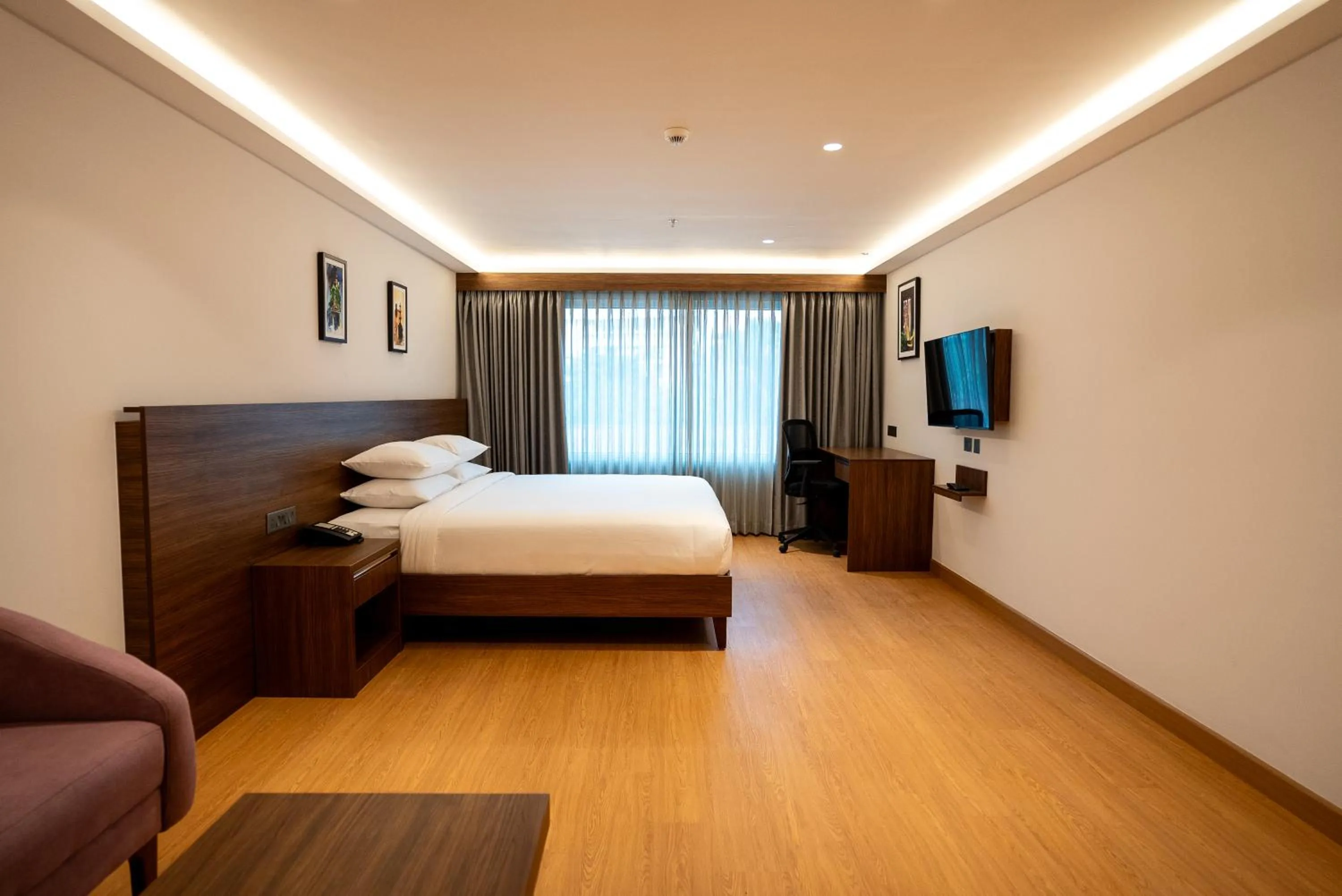 Bed in Lilac Hotel Guruvayur