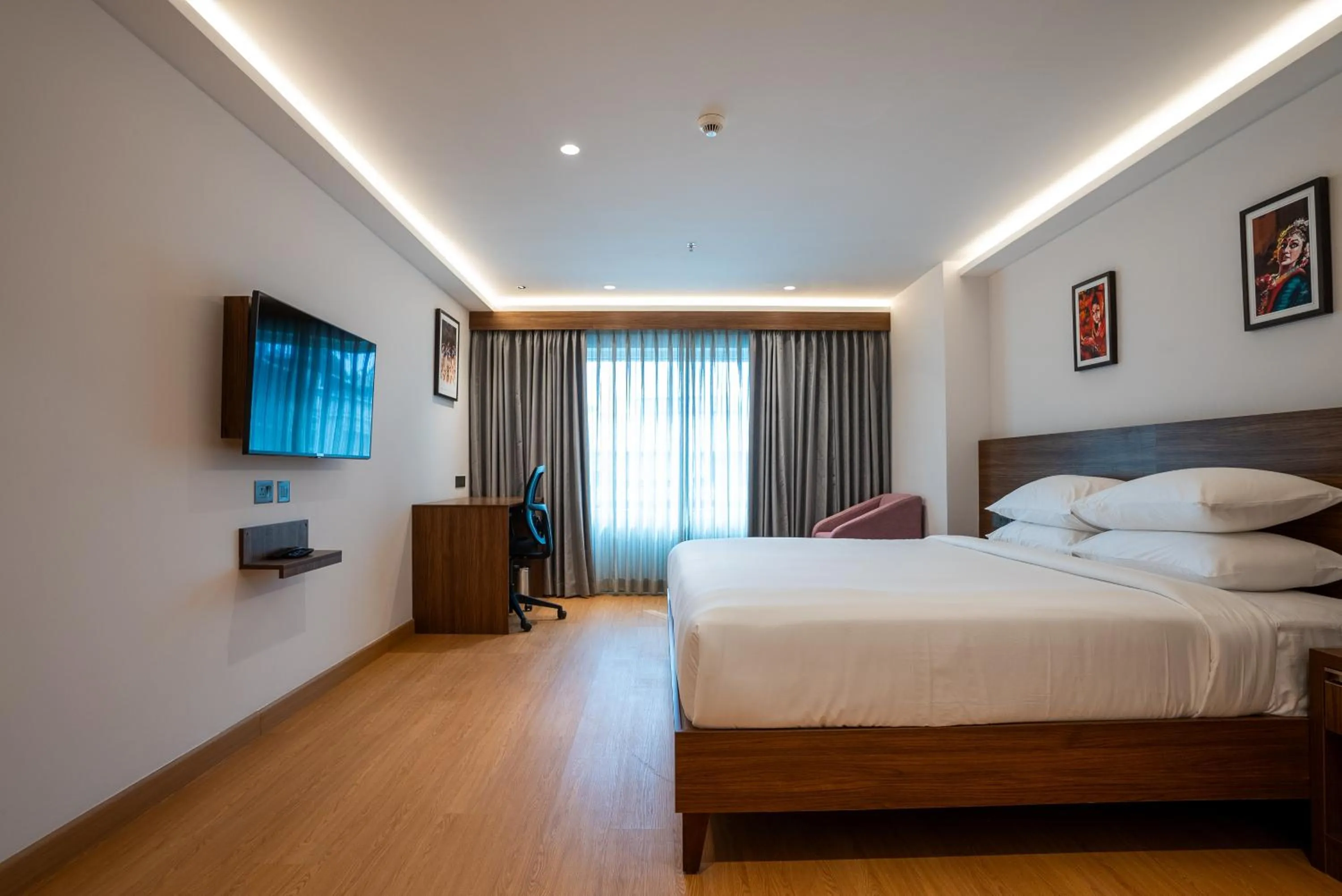 Bed in Lilac Hotel Guruvayur