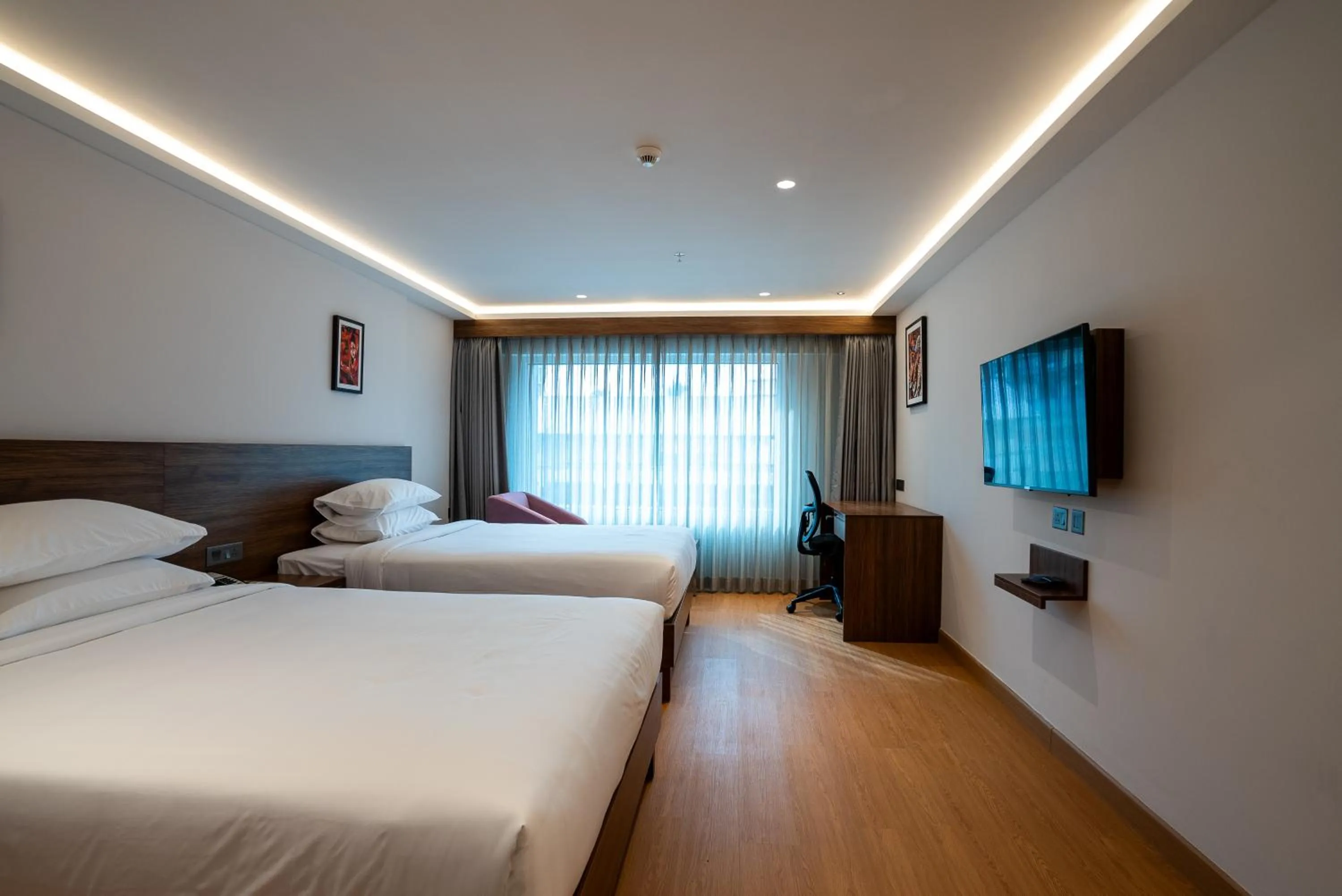 Bed in Lilac Hotel Guruvayur
