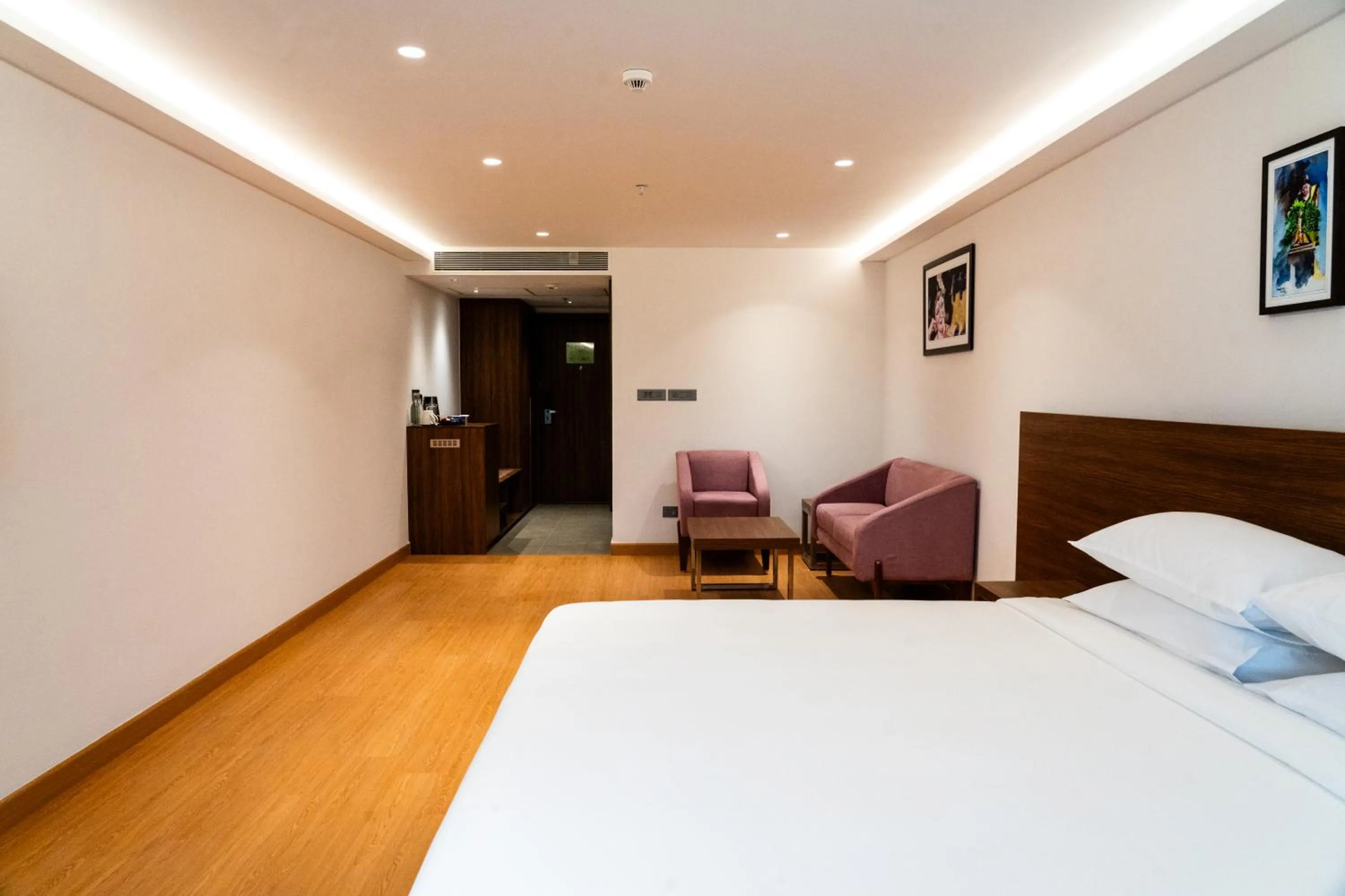 Bed in Lilac Hotel Guruvayur