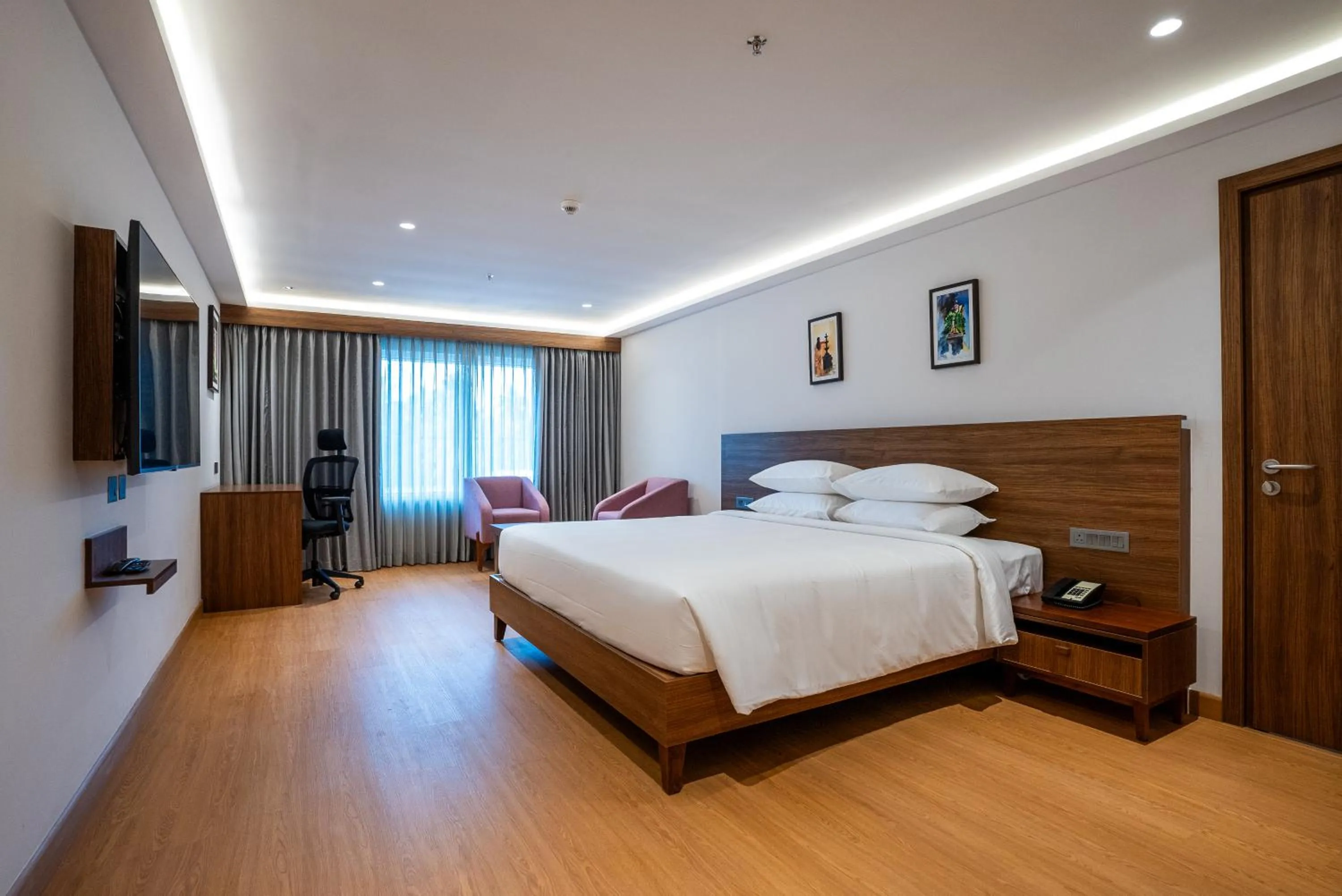 Bed in Lilac Hotel Guruvayur