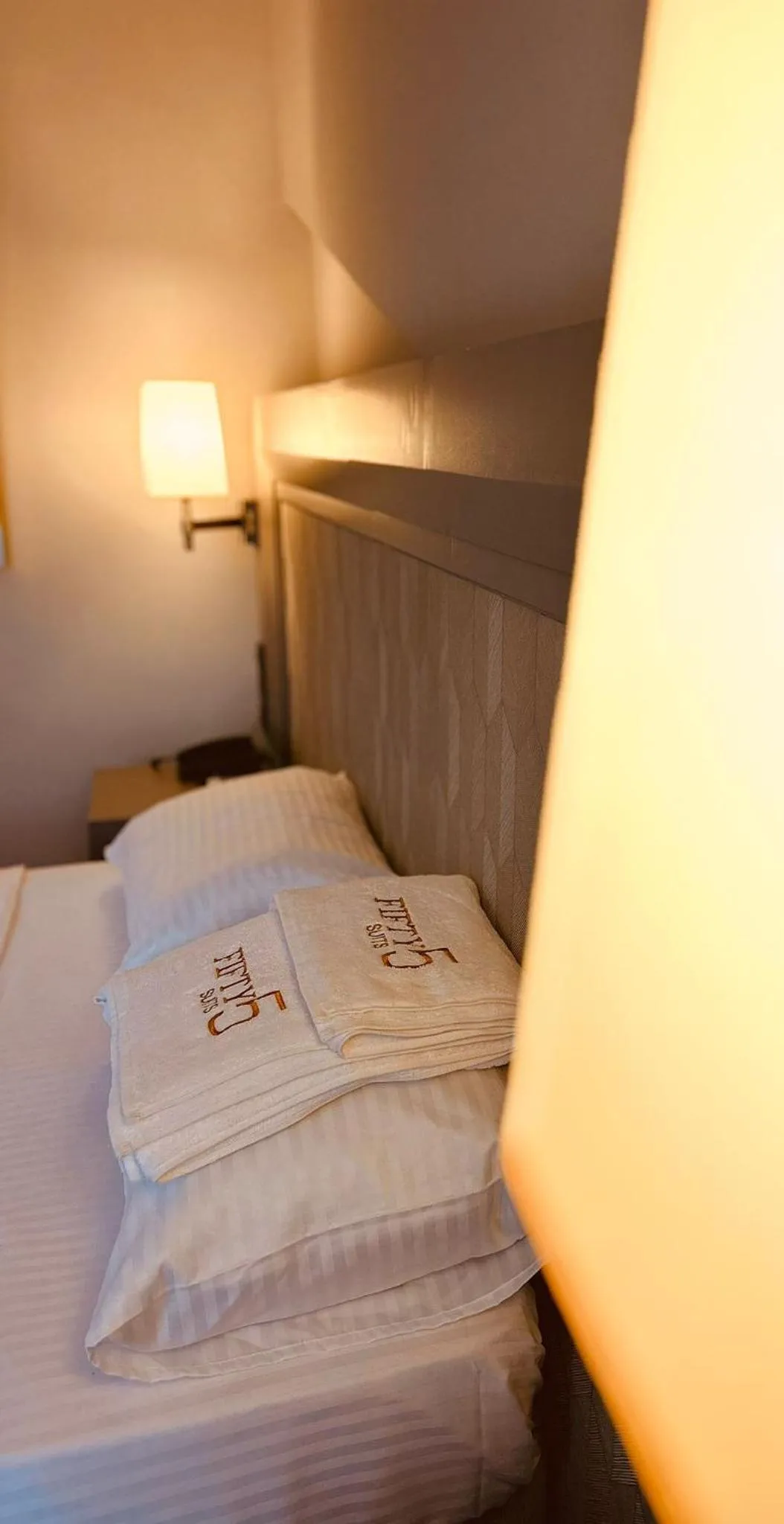 Bed in FIFTY5 Suite Hotel