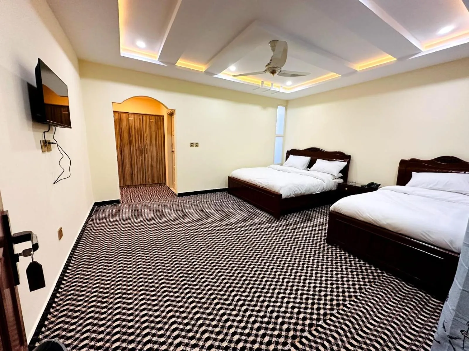 Communal lounge/ TV room, Bed in Desert One Hotel Skardu