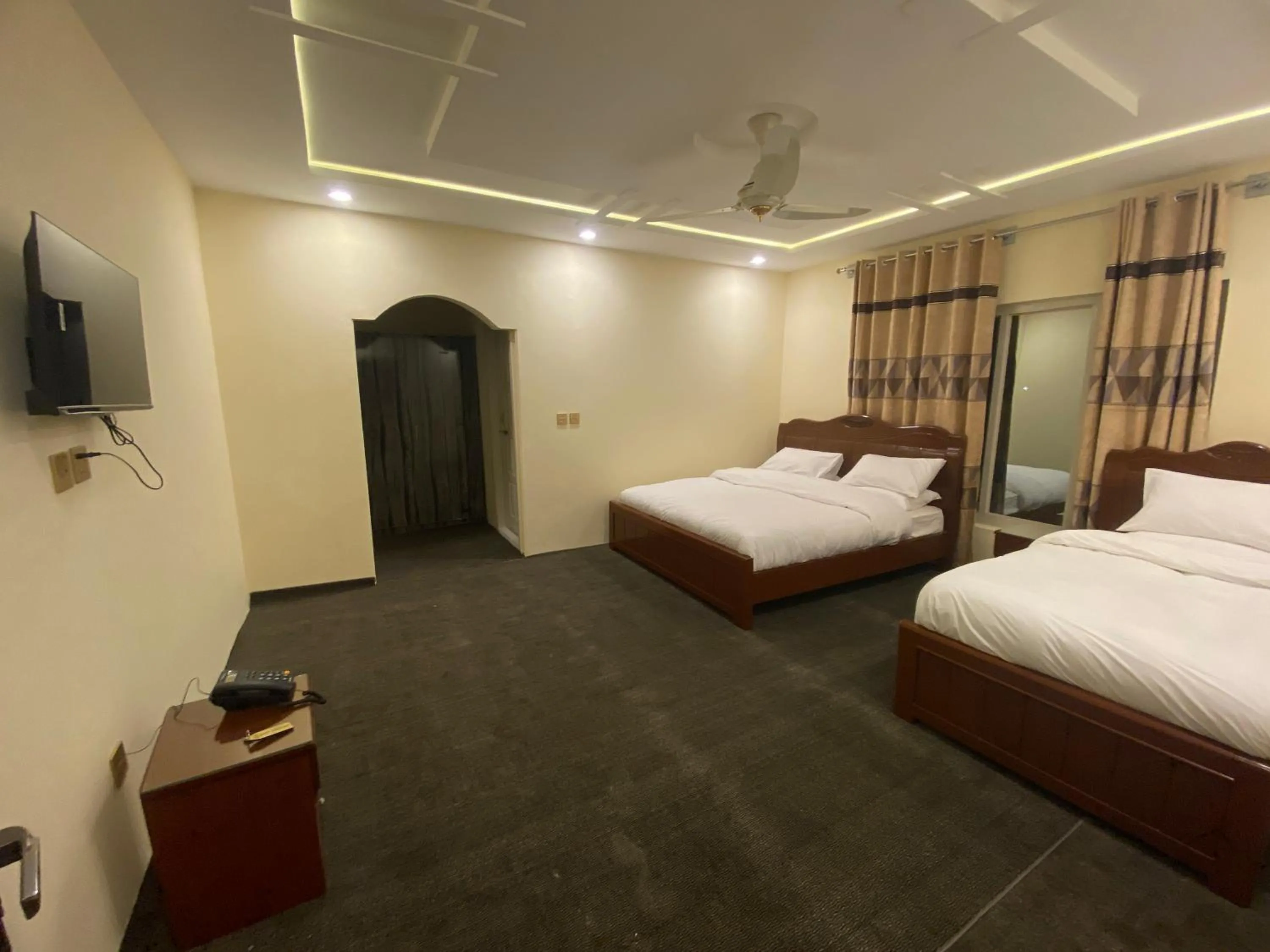 Communal lounge/ TV room, Bed in Desert One Hotel Skardu