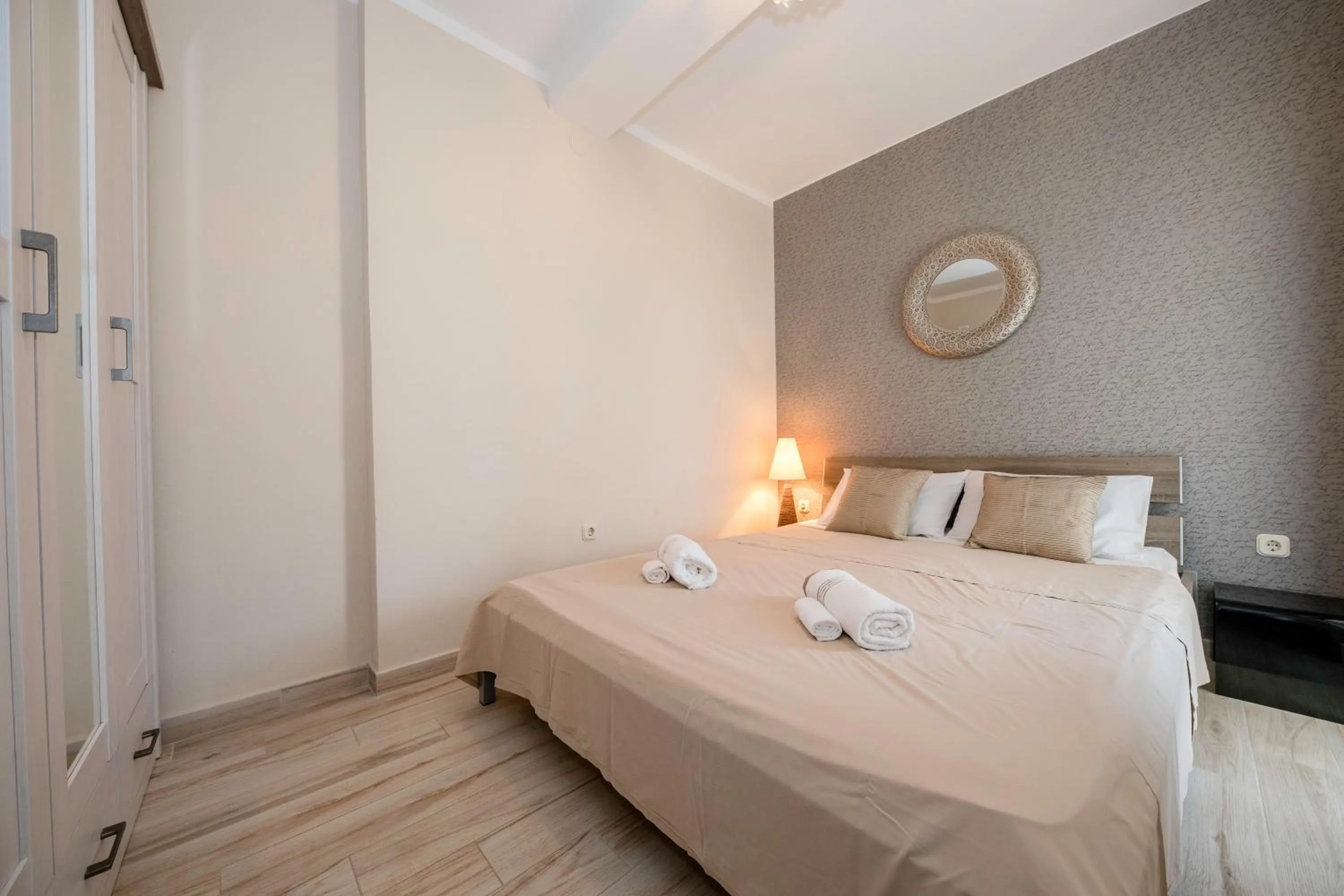 Bed in Apartments by the Beach with Pool and Lounge Beds - Miral Apartments