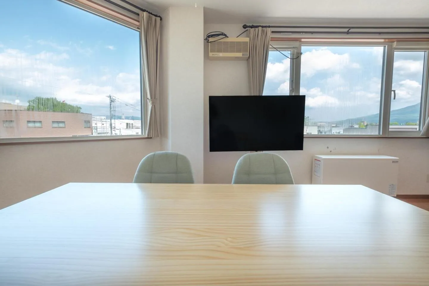 Communal lounge/ TV room in Ezo Fujiya Niseko House