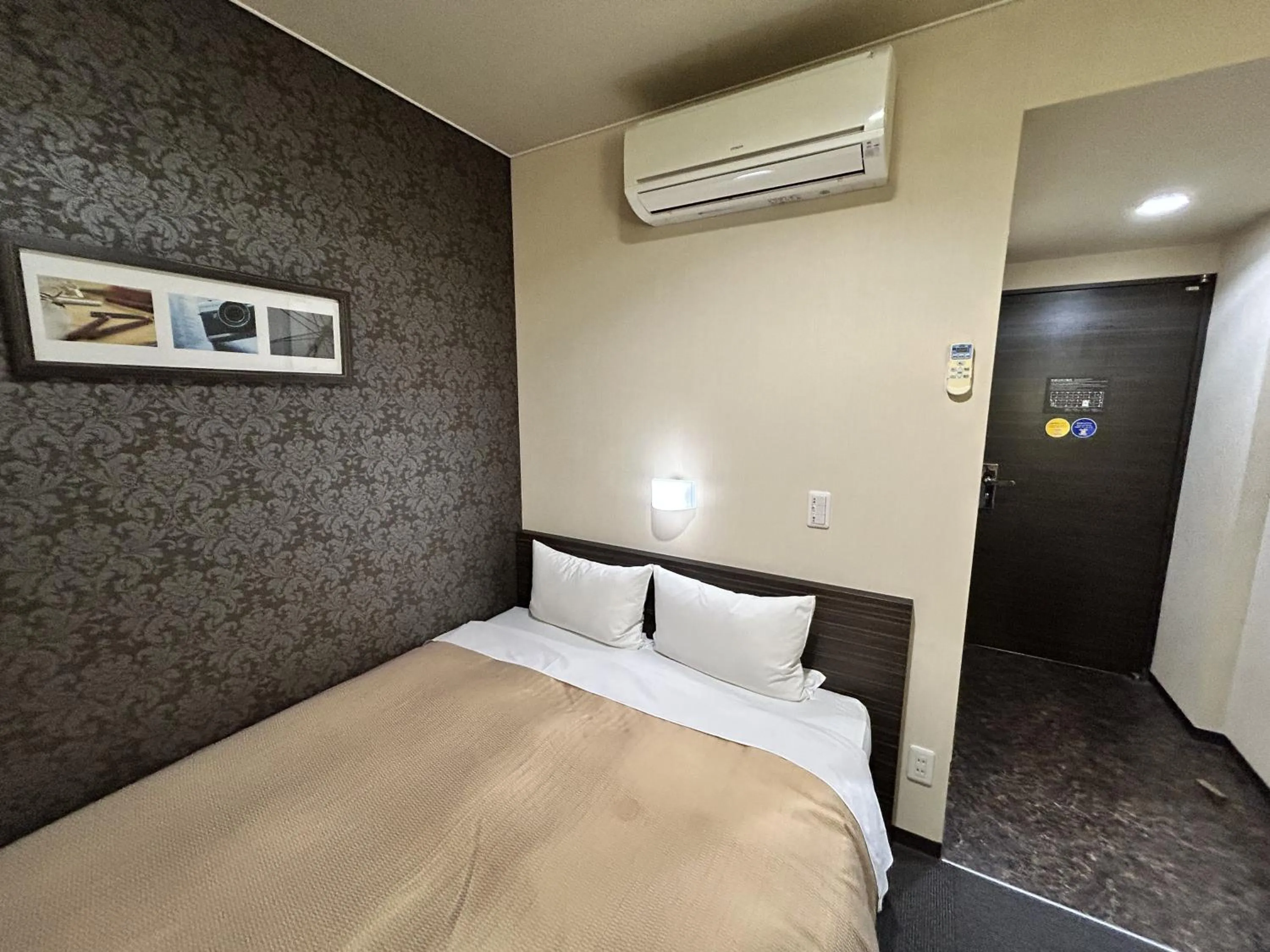 Bed in Smile Hotel Kokura