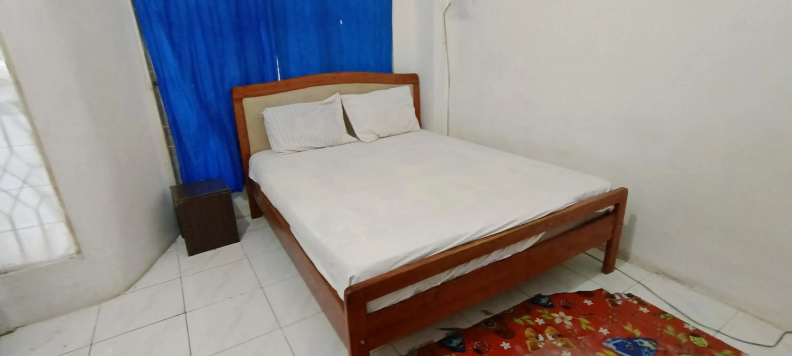 Bedroom, Bed in Hotel O Wisma Parakita Syariah Near RS Faisal Patalasang