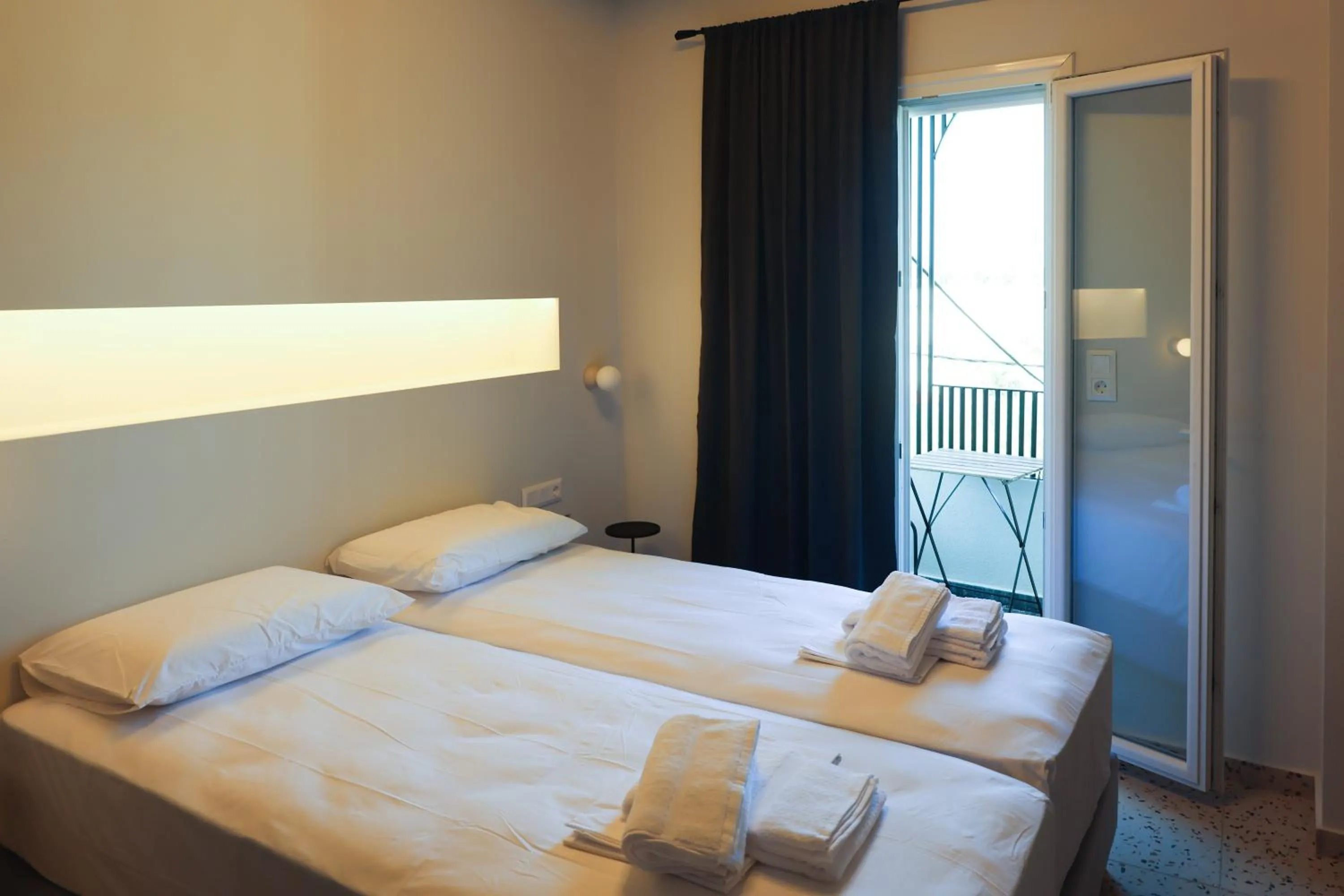 Bed in Uphill Unique Boutique Suites