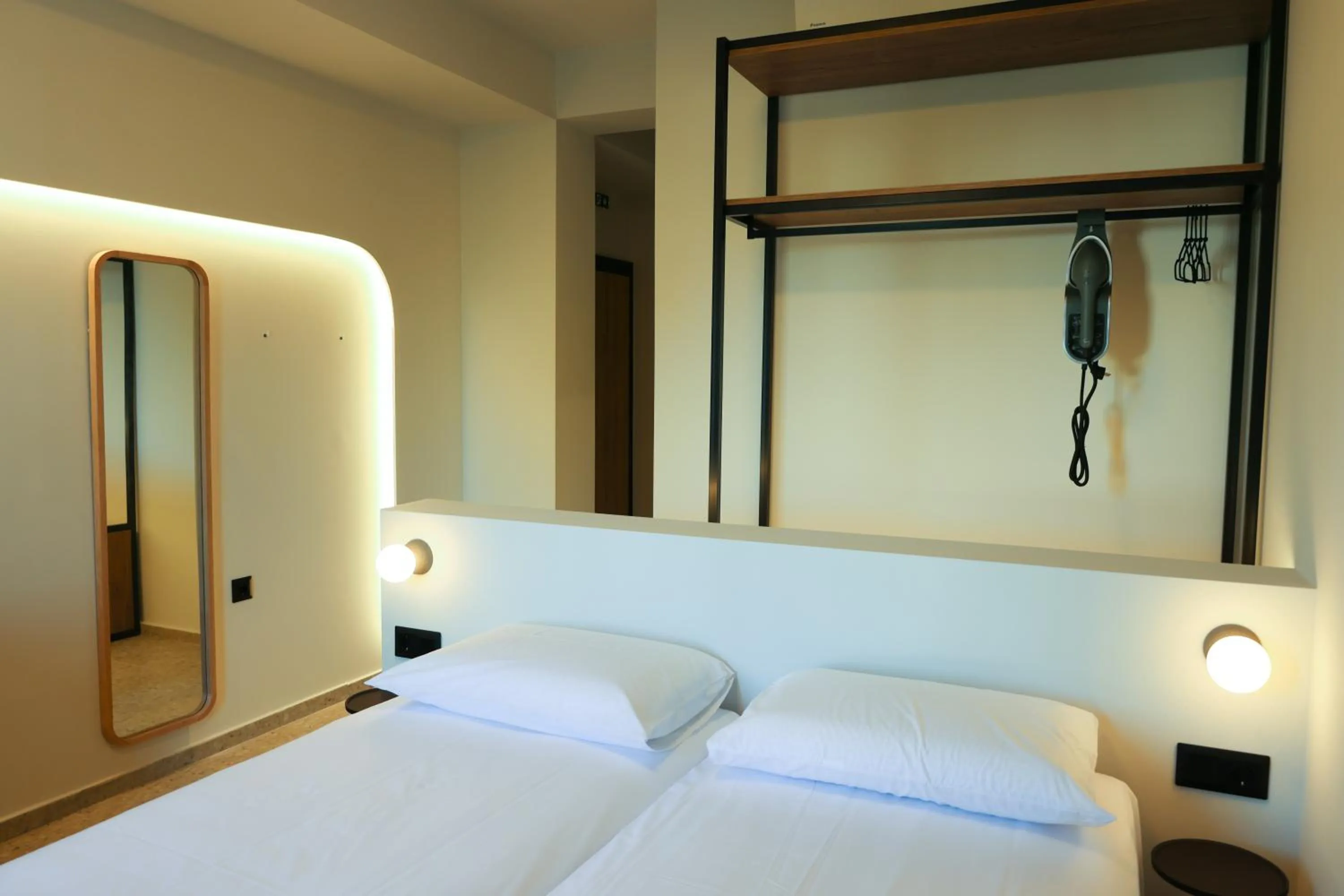 Bed in Uphill Unique Boutique Suites