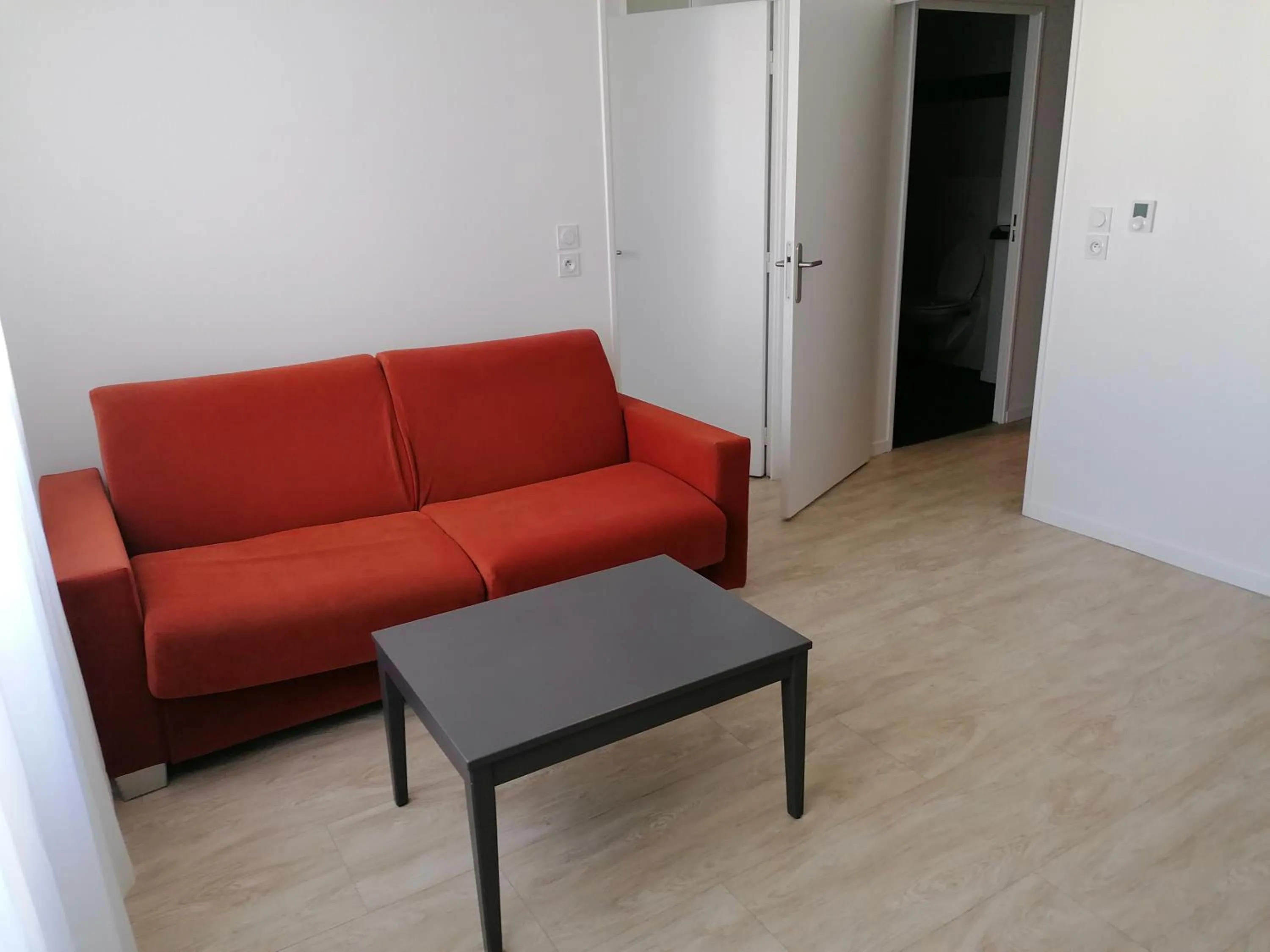 Seating area in Terres de France - Appart Hôtel Rouen Flaubert