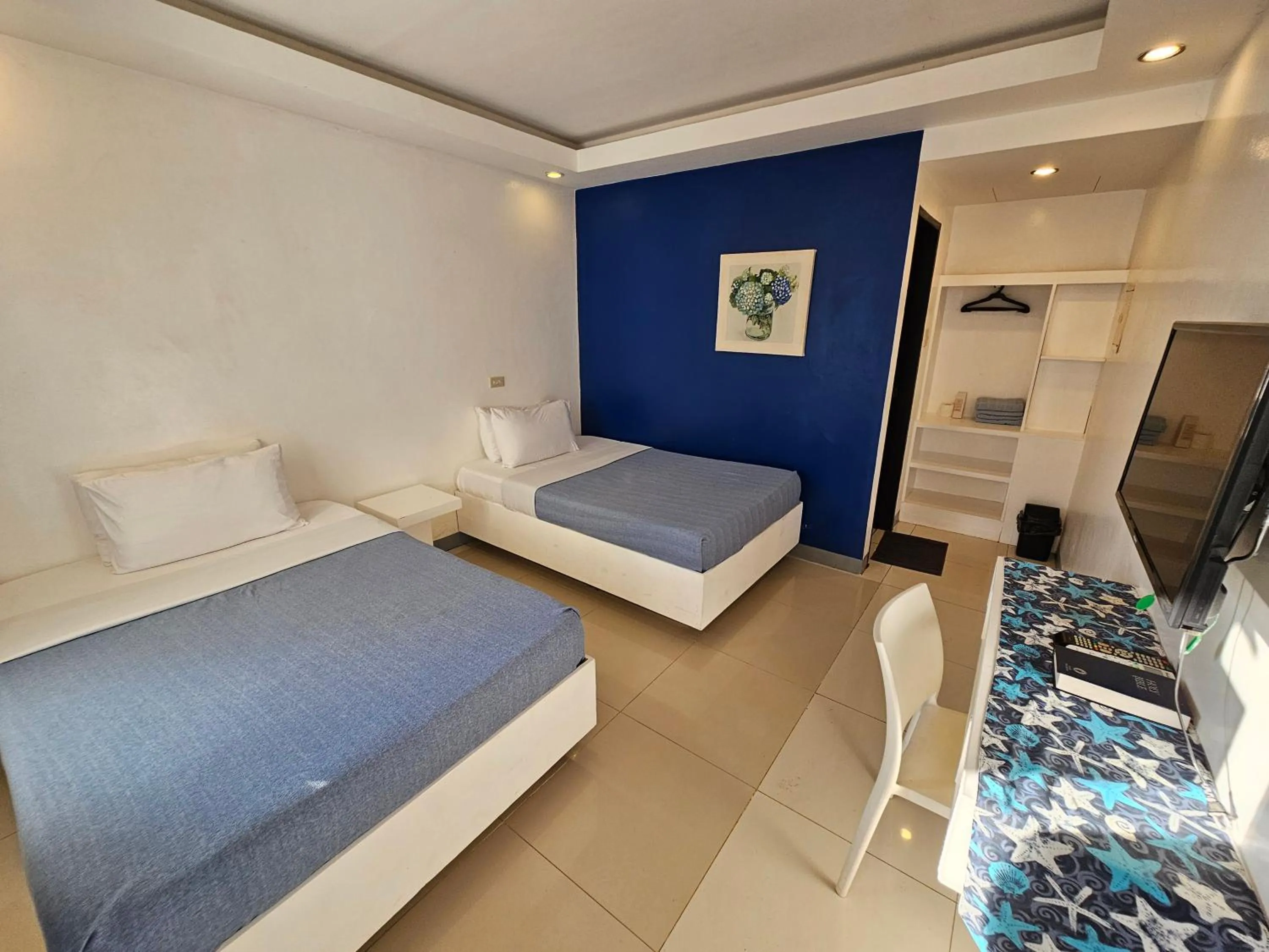 Bed in Blue Coast Beach Hotel