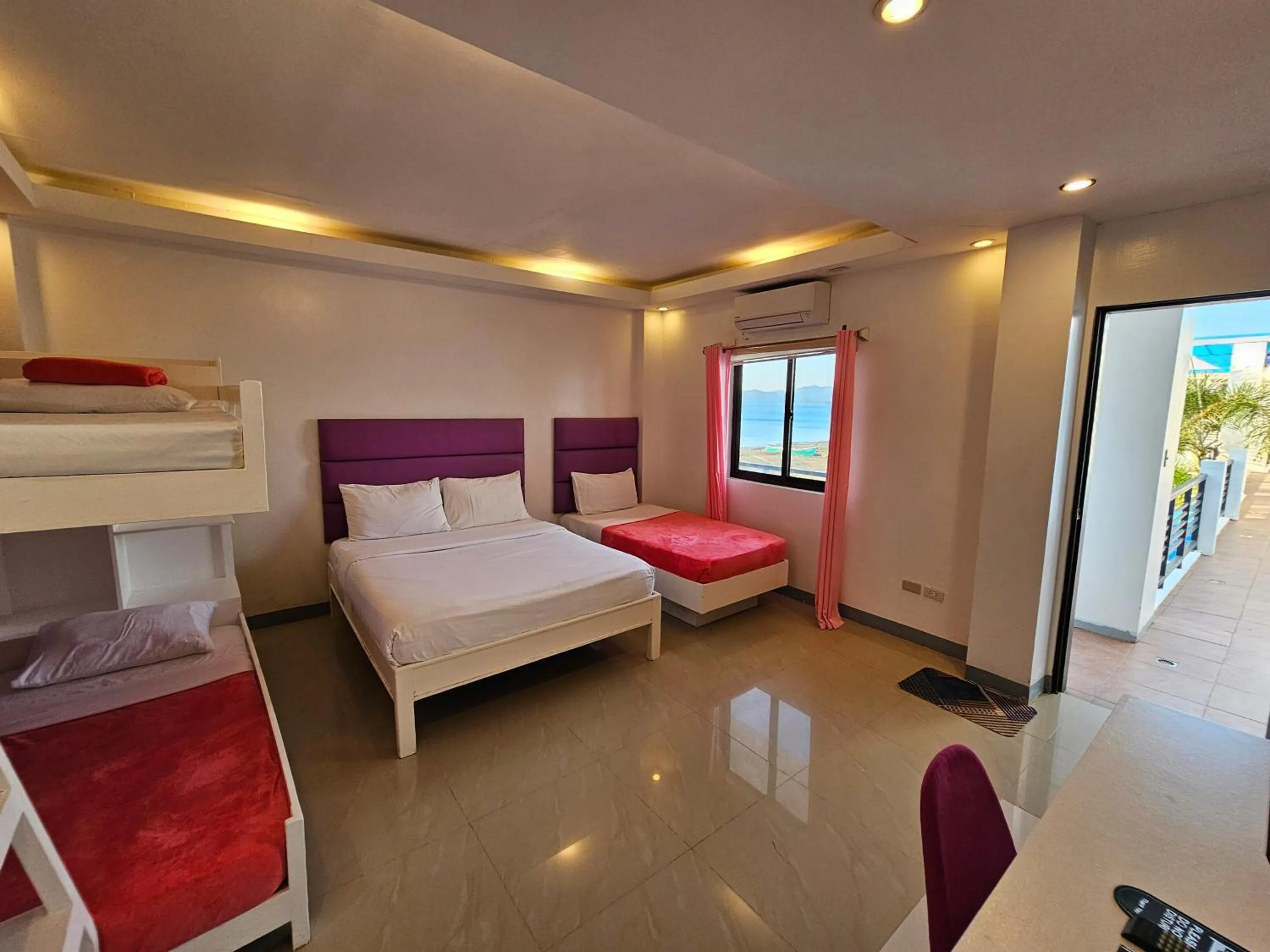 Bed in Blue Coast Beach Hotel