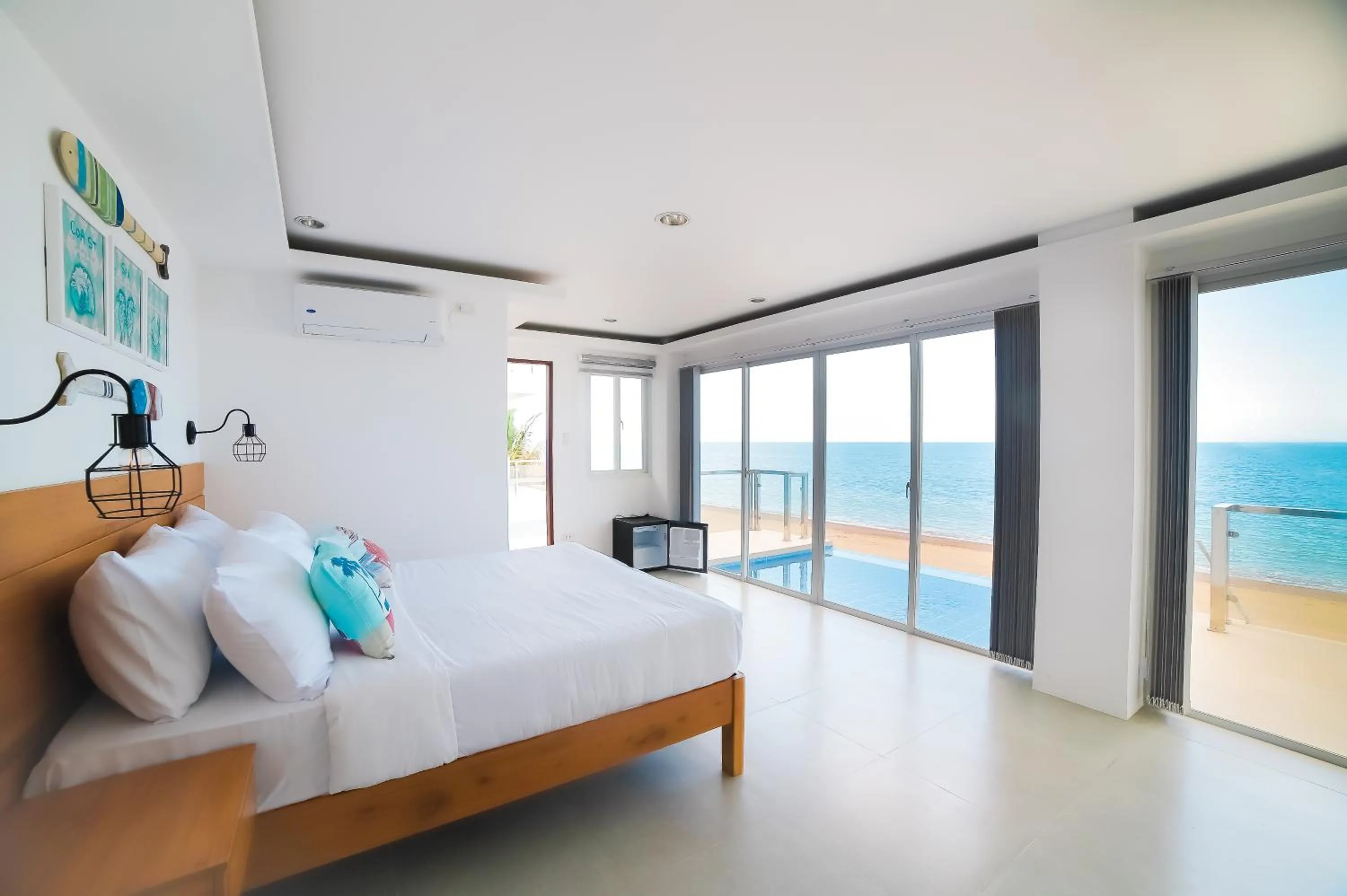 Bed in Blue Coast Beach Hotel