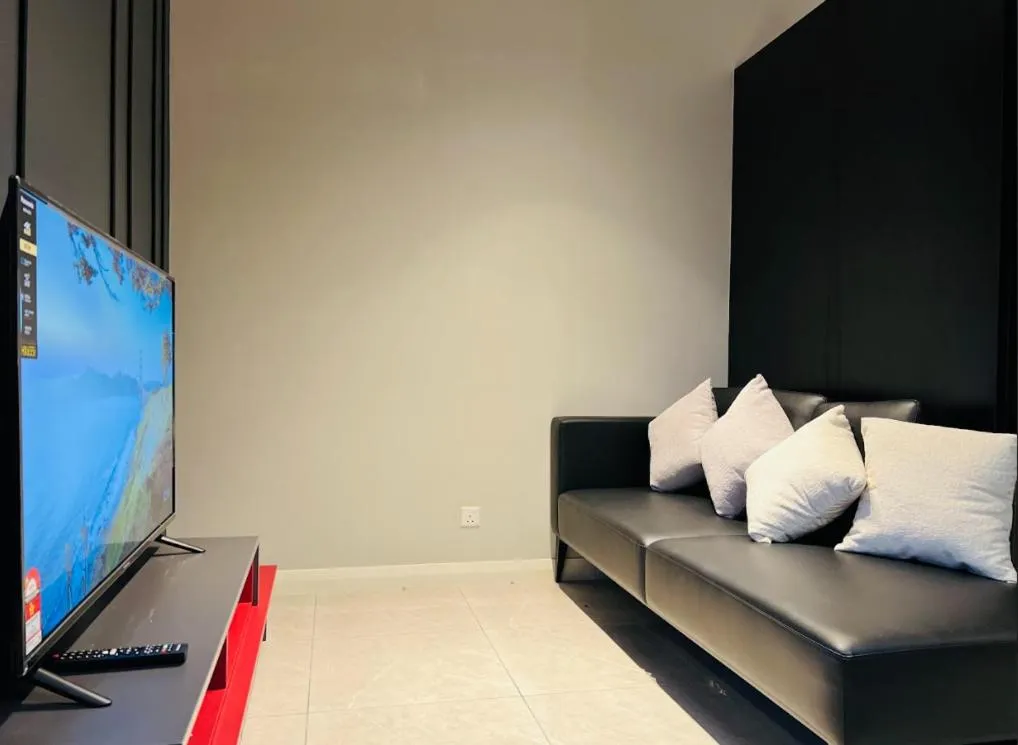 Communal lounge/ TV room in The Axon Bukit Bintang by SMOVF BNB