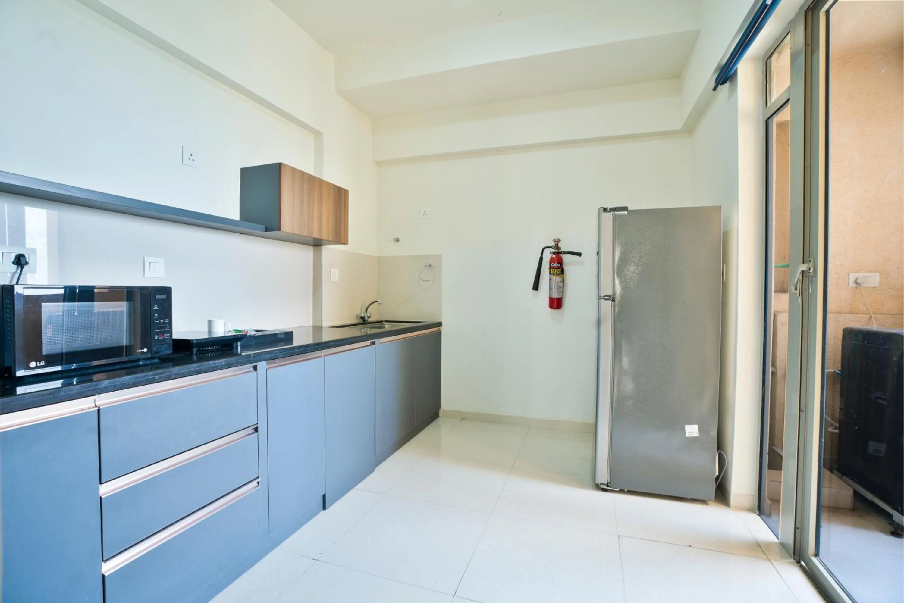 kitchen in Apartel by Aarin - Oragadam