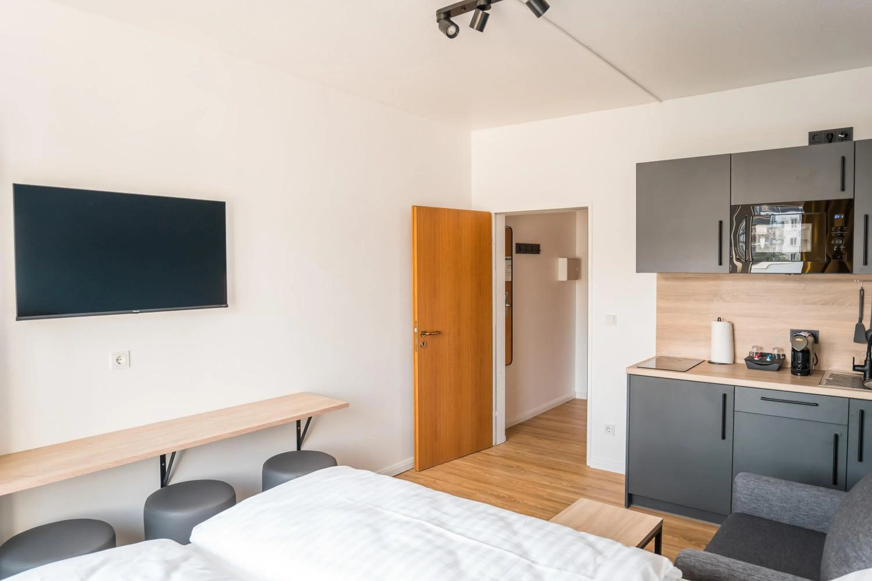 Bed in Antares Apartments