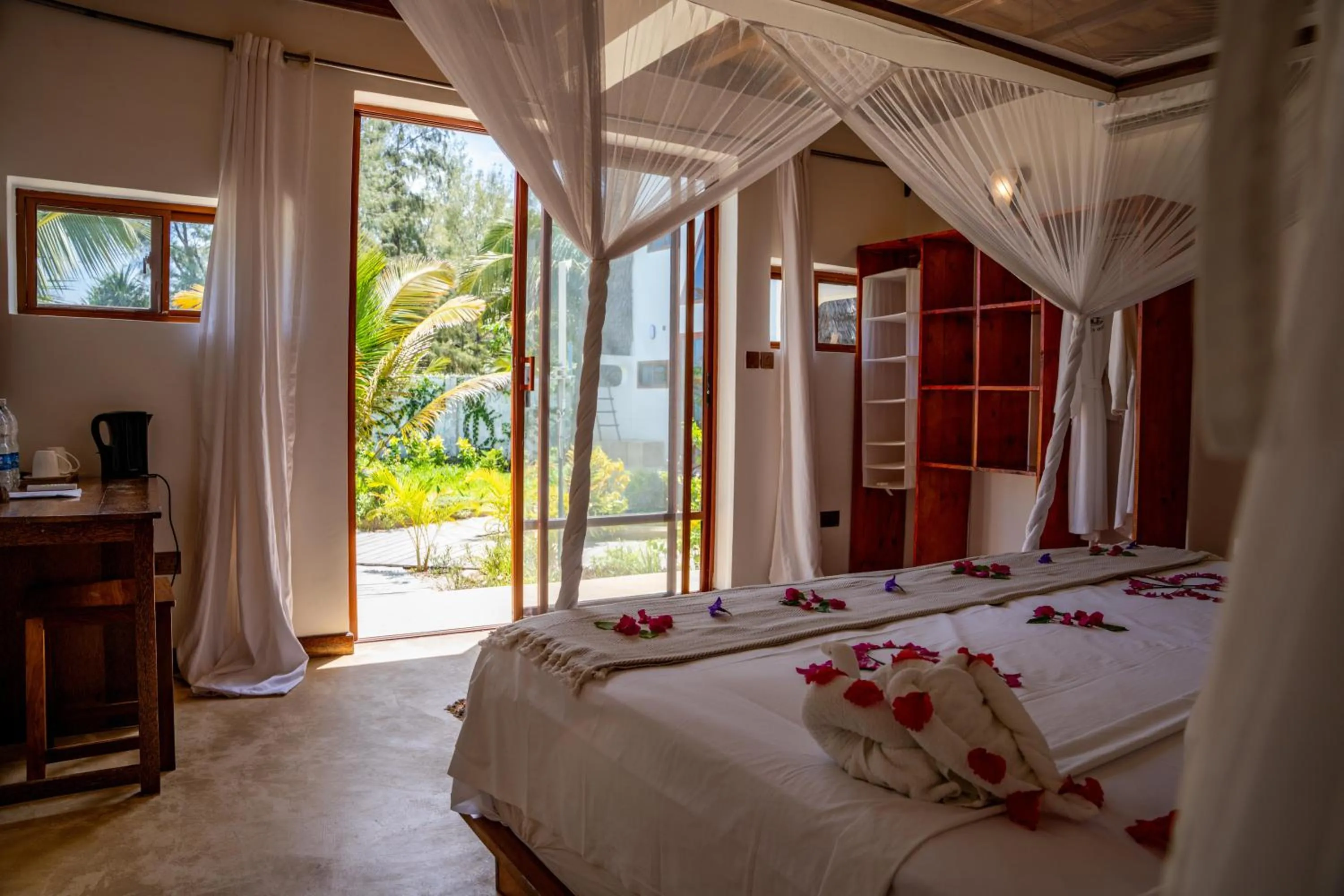 Photo of the whole room, Bed in La Perla Beach Resort, Zanzibar - Your Beachfront Private Haven