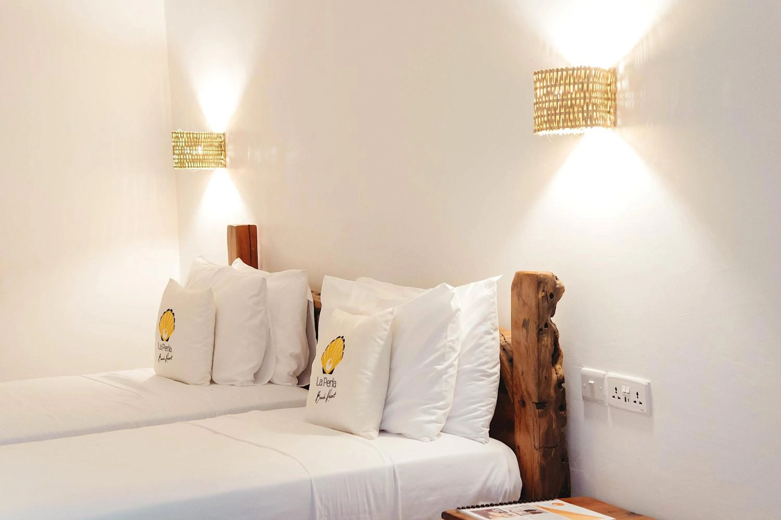 Photo of the whole room, Bed in La Perla Beach Resort, Zanzibar - Your Beachfront Private Haven