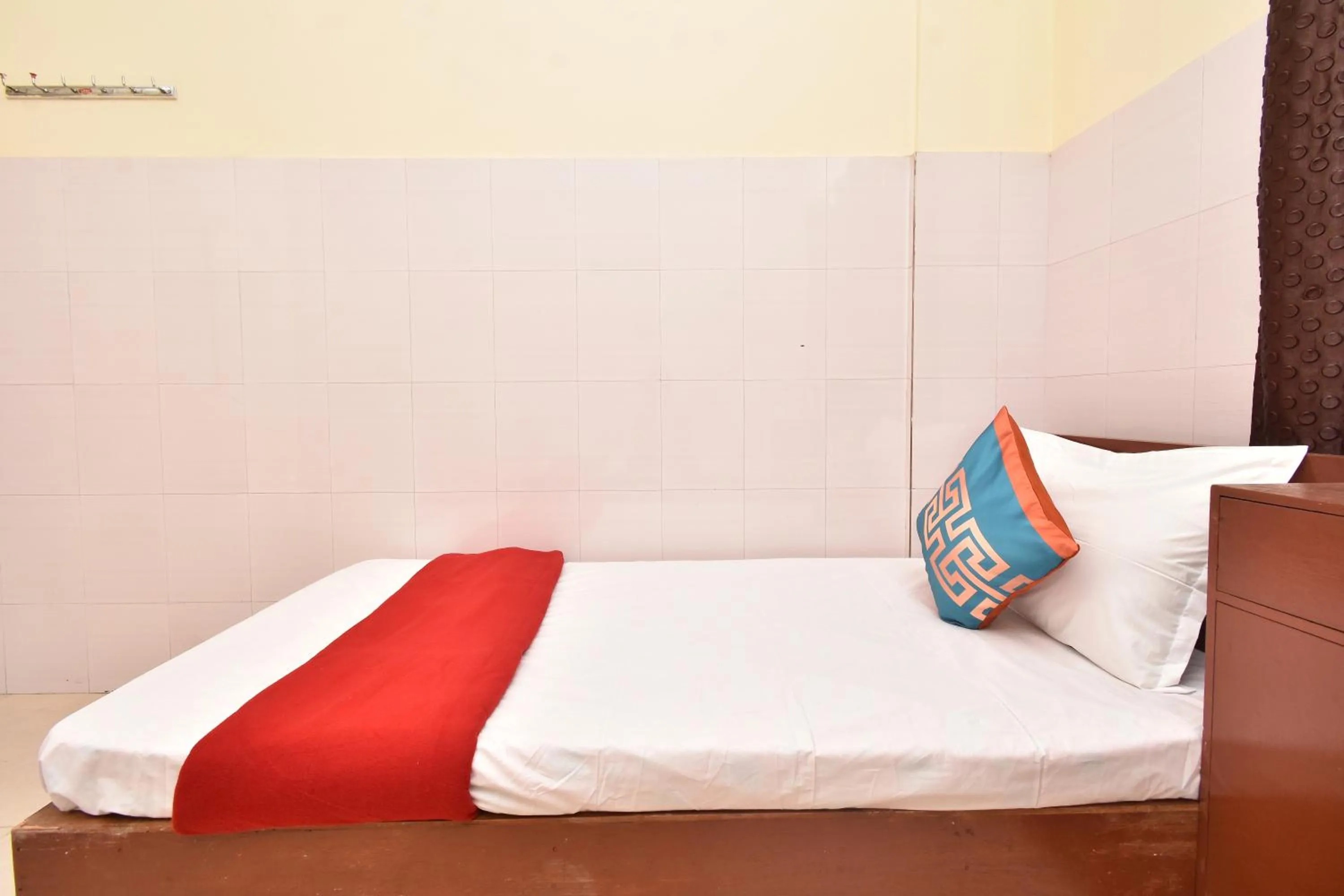 Bed in HOTEL KANNUR CAPITAL CALTEX