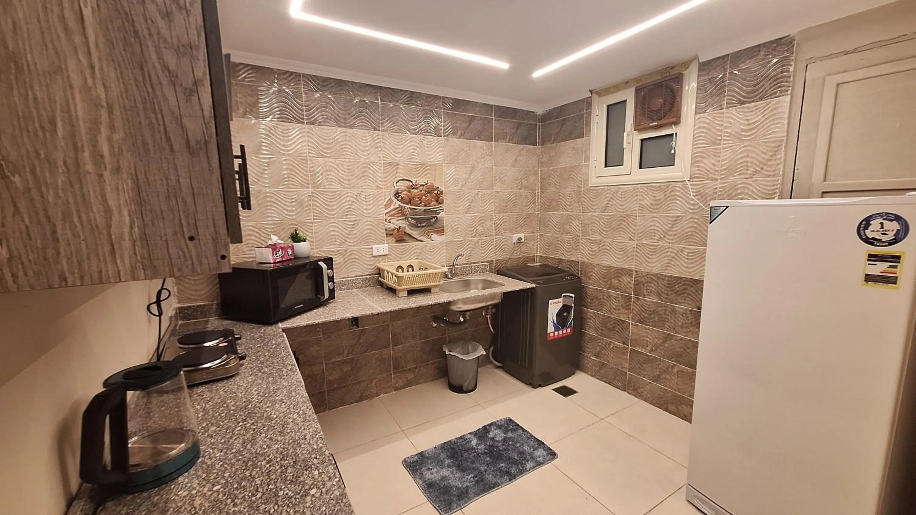 Kitchen or kitchenette in downtown Family Suites