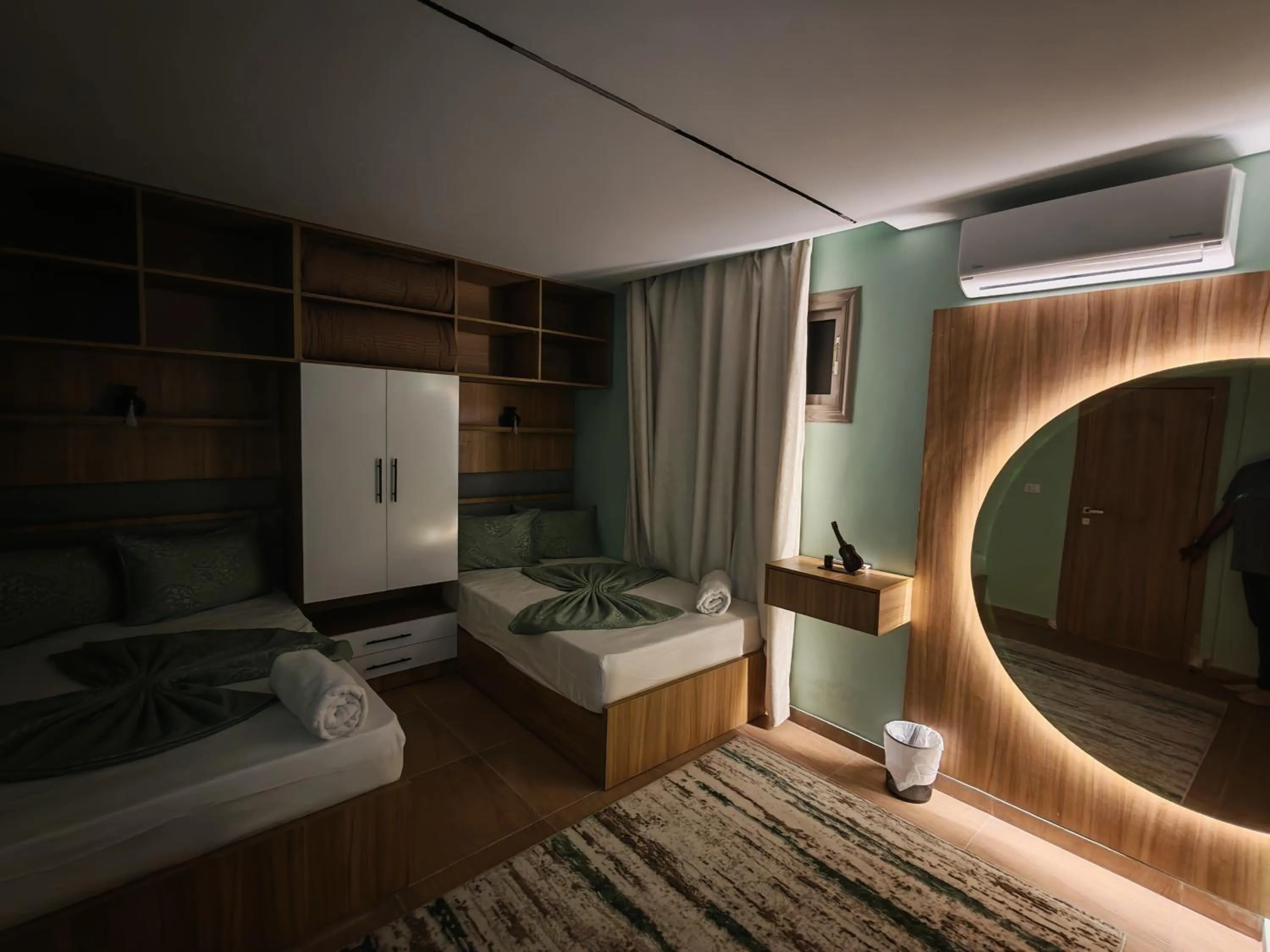 Photo of the whole room, Bed in downtown Family Suites