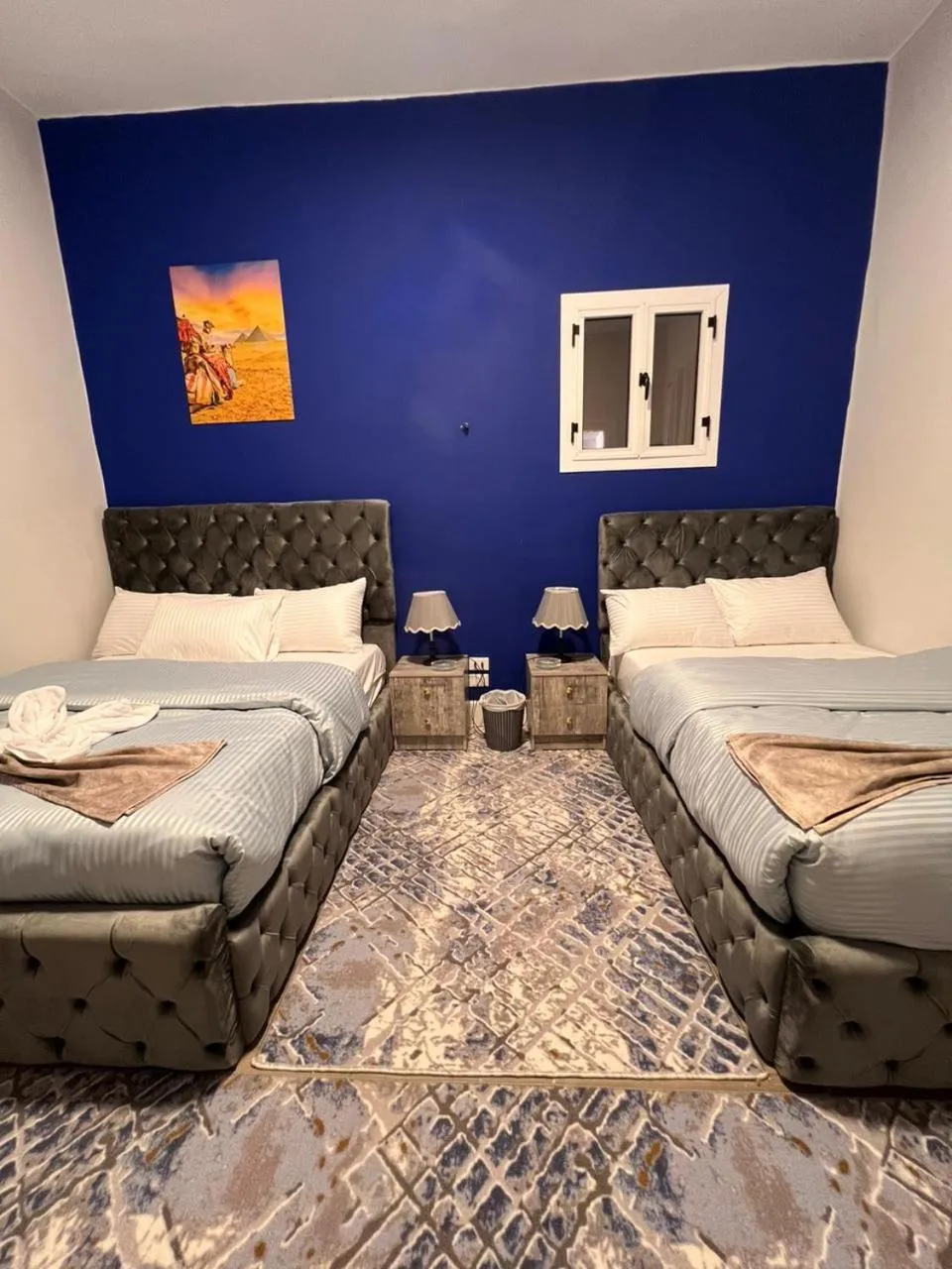 Photo of the whole room, Bed in downtown Family Suites