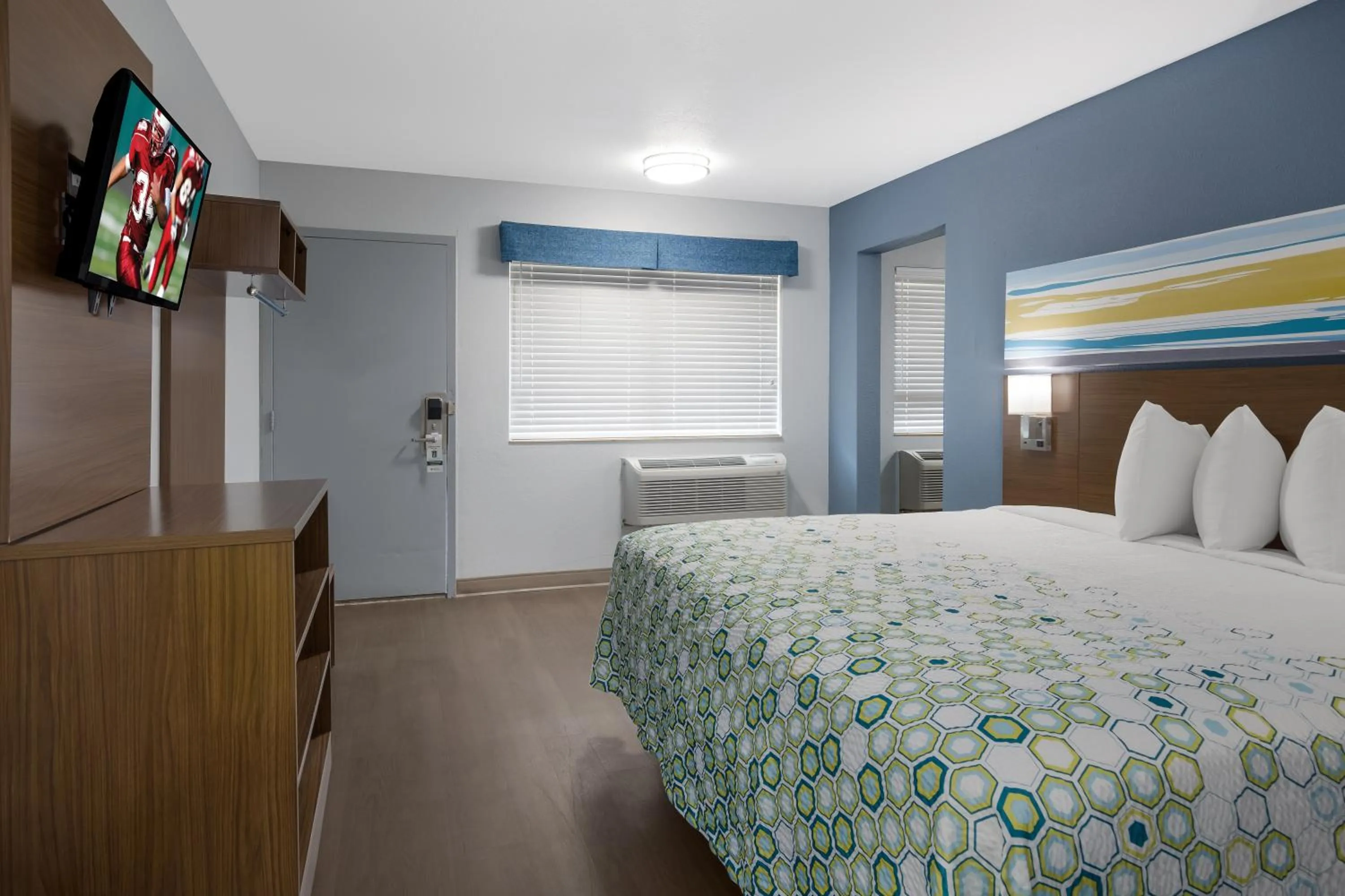 Bedroom, Bed in HomeTowne Studios by Red Roof Orange, TX