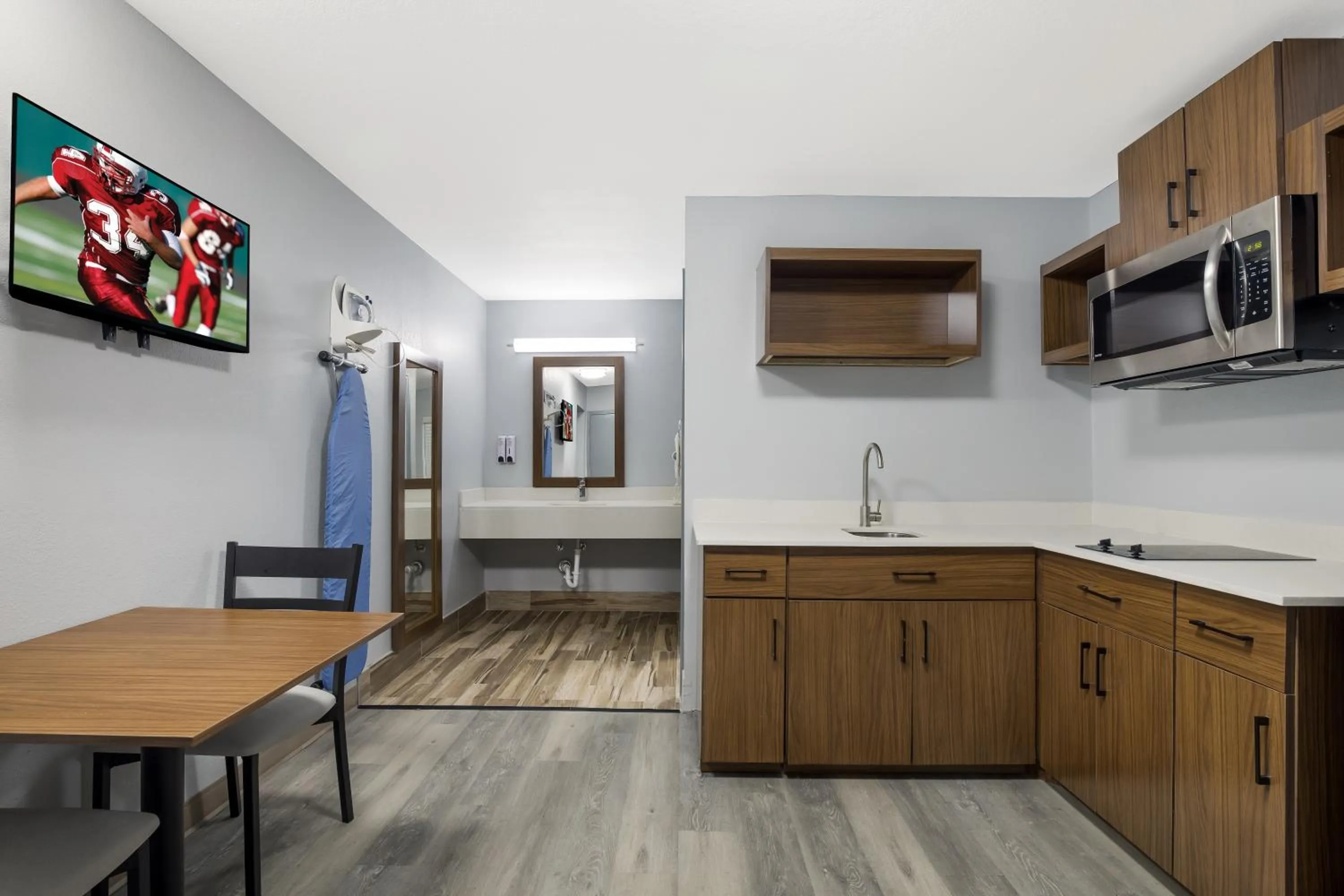 Kitchen or kitchenette in HomeTowne Studios by Red Roof Orange, TX