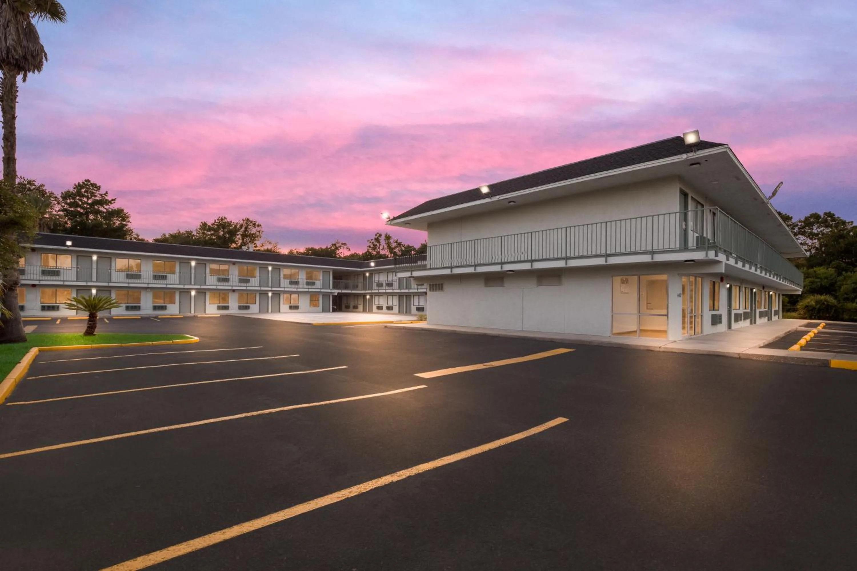 Property building in HomeTowne Studios by Red Roof Orange, TX