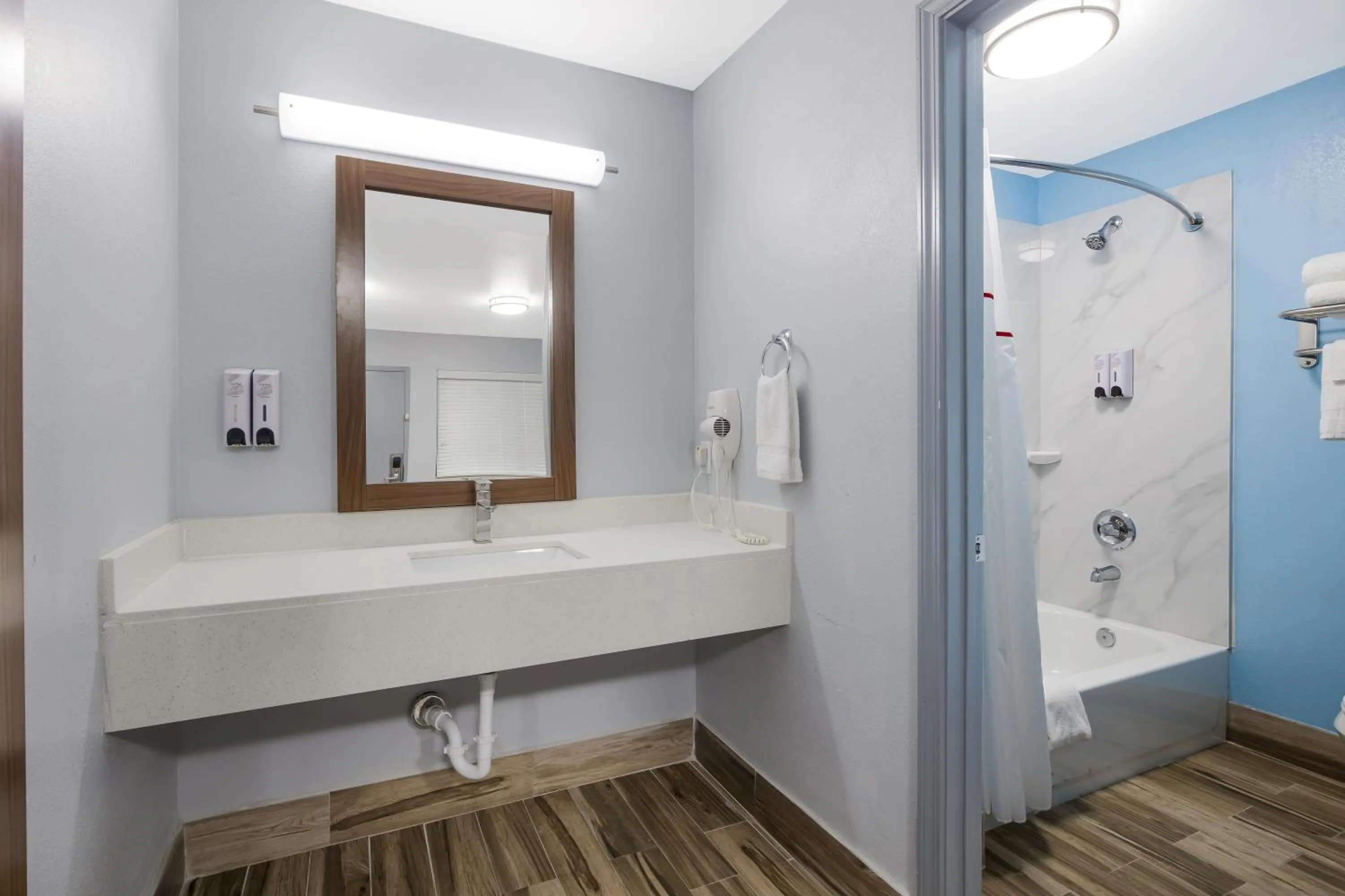 Bathroom in HomeTowne Studios by Red Roof Orange, TX