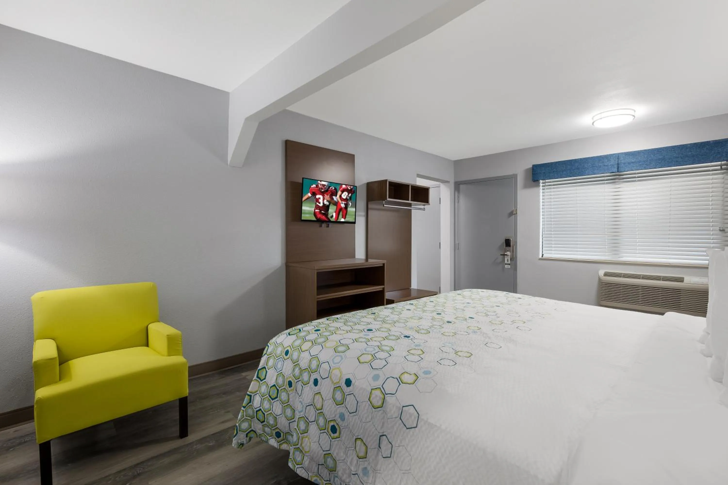 Bed in HomeTowne Studios by Red Roof Orange, TX