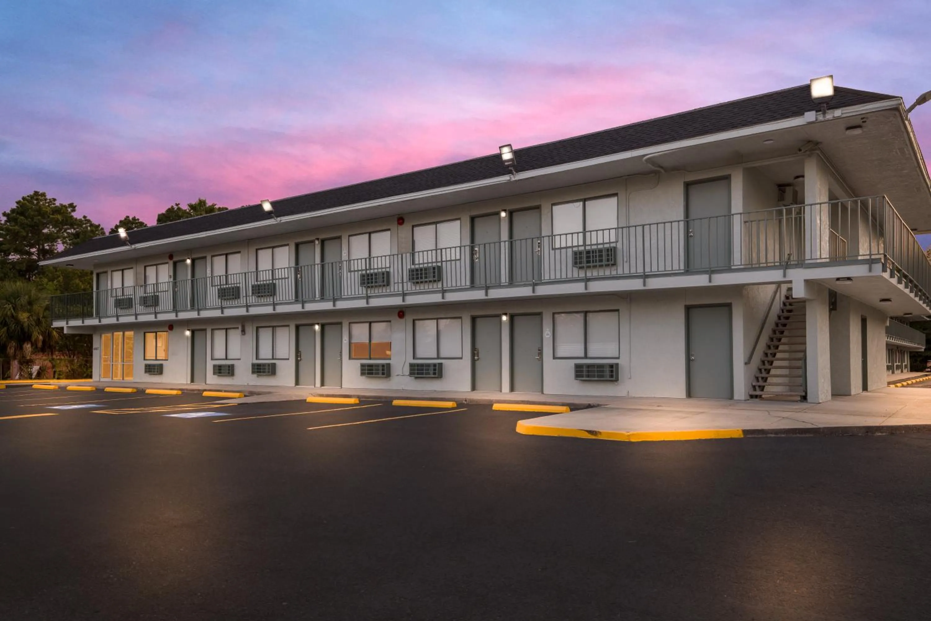 Property building in HomeTowne Studios by Red Roof Orange, TX