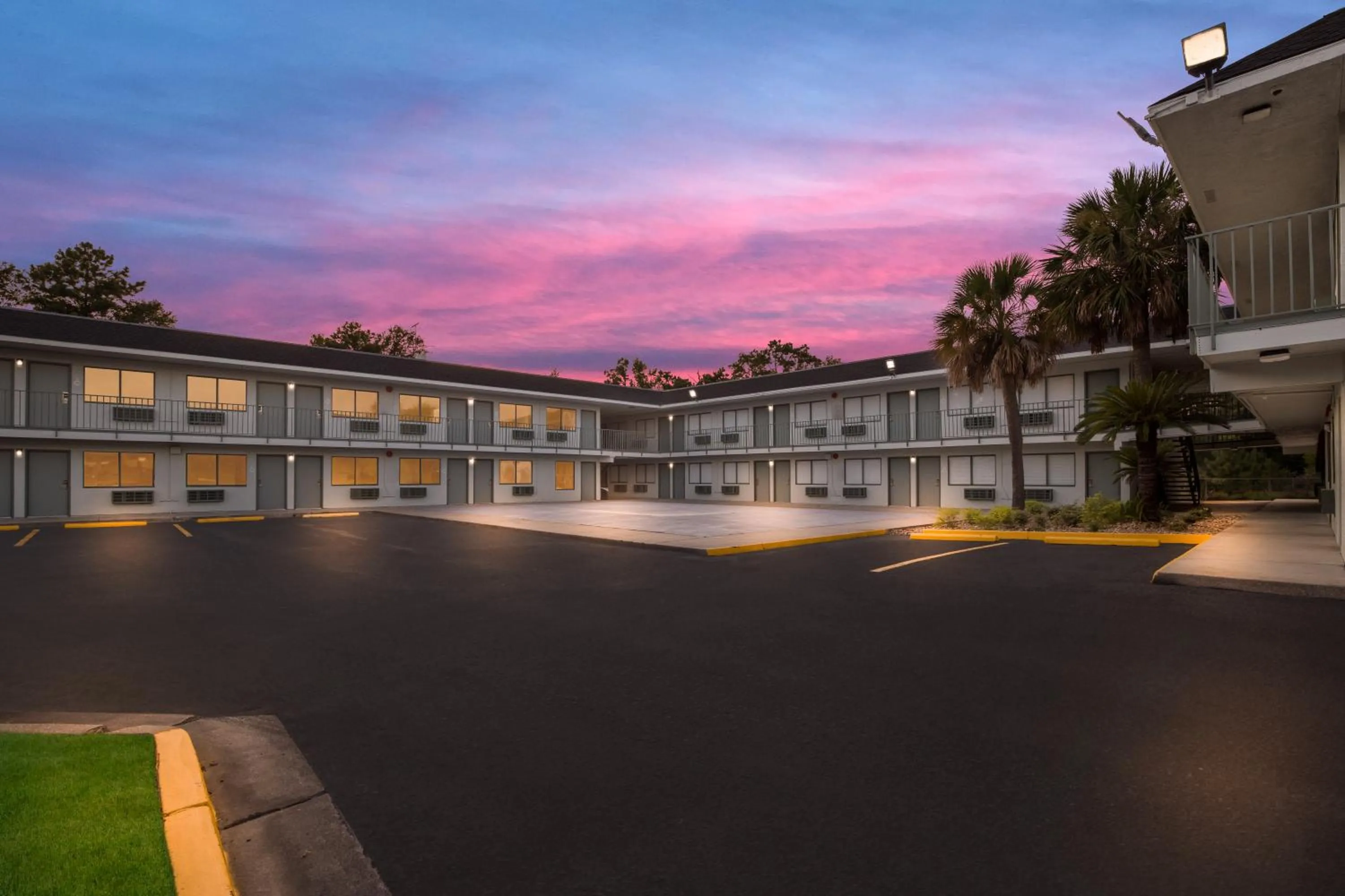 Property building in HomeTowne Studios by Red Roof Orange, TX