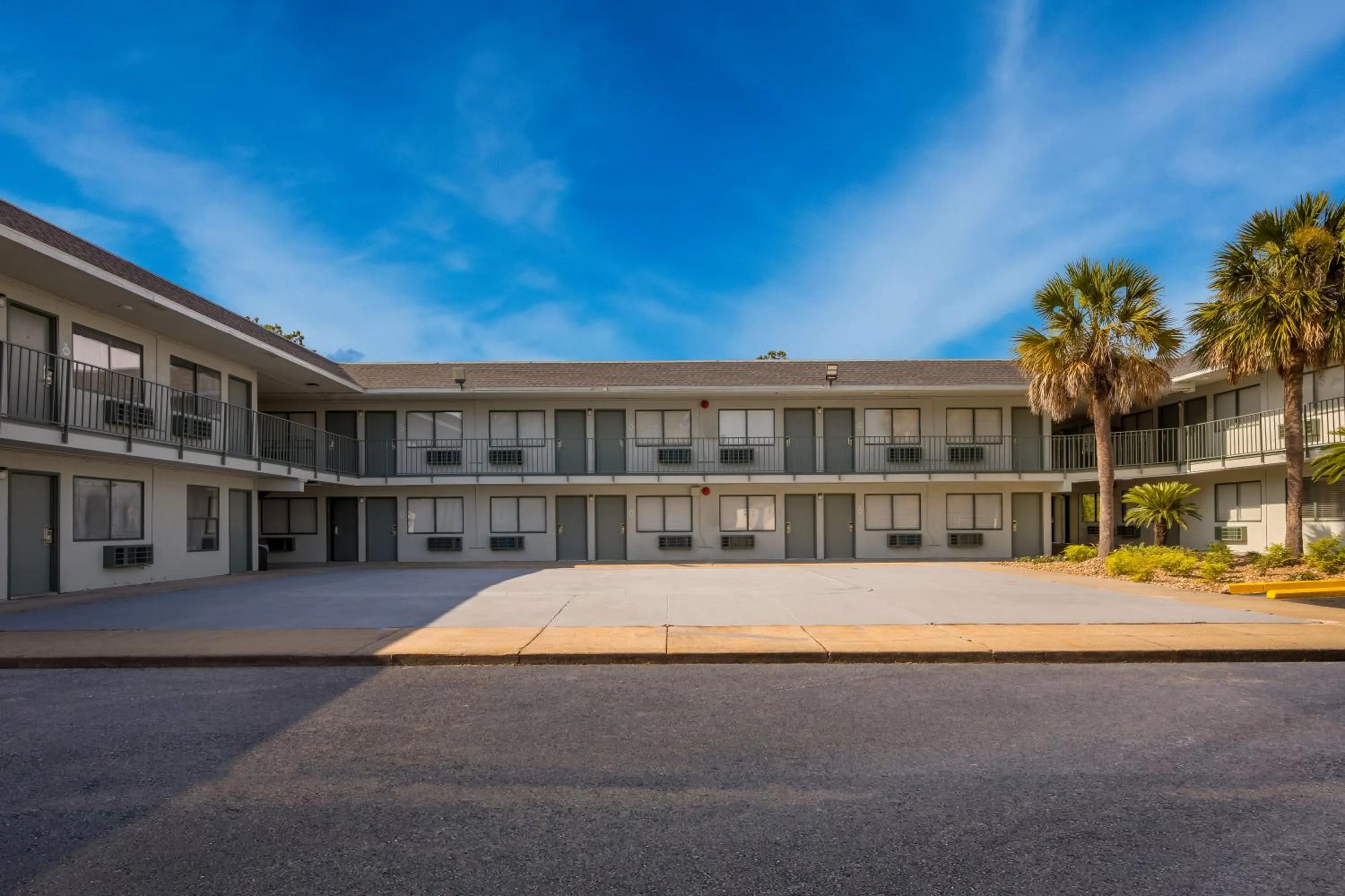 Property building in HomeTowne Studios by Red Roof Orange, TX
