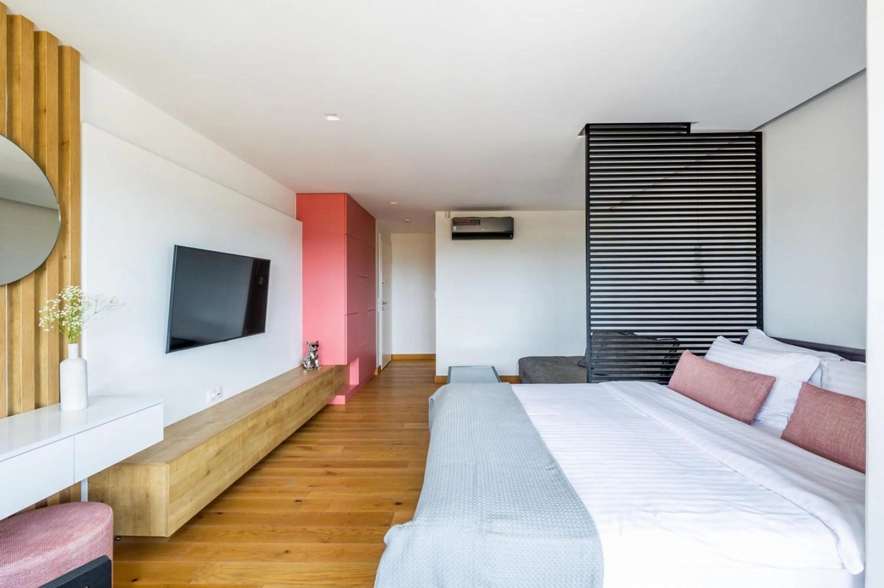 Bed in Earth Boutique Apartments next to Stavros Niarchos