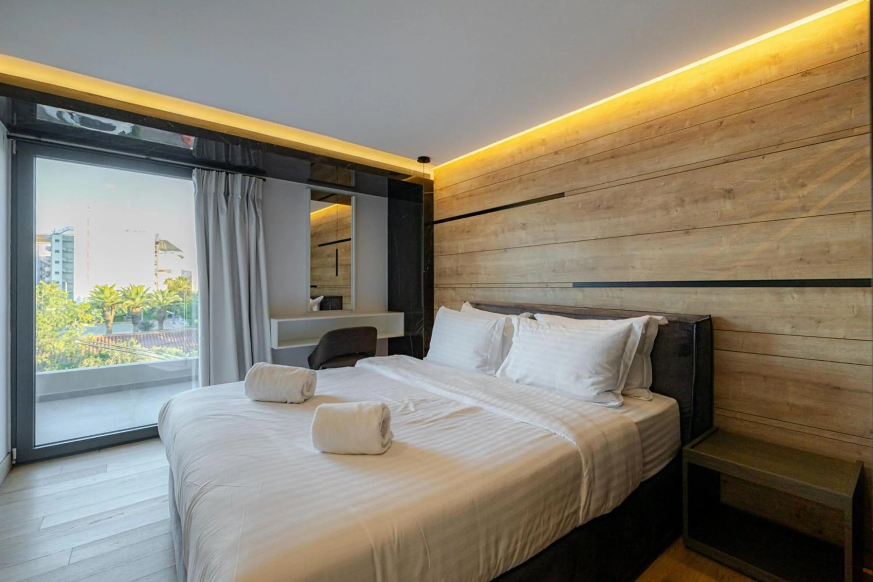 Bedroom in Earth Boutique Apartments next to Stavros Niarchos