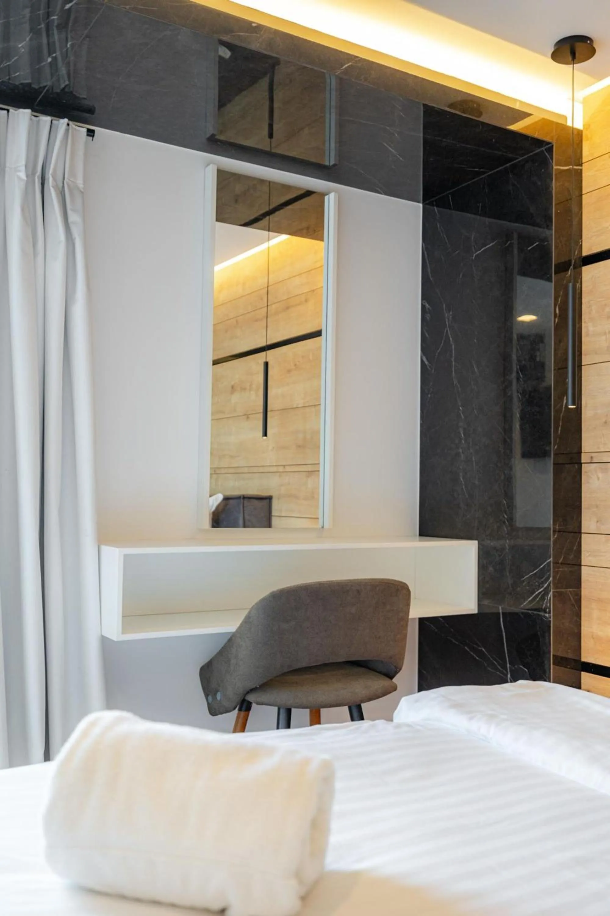 Bedroom in Earth Boutique Apartments next to Stavros Niarchos
