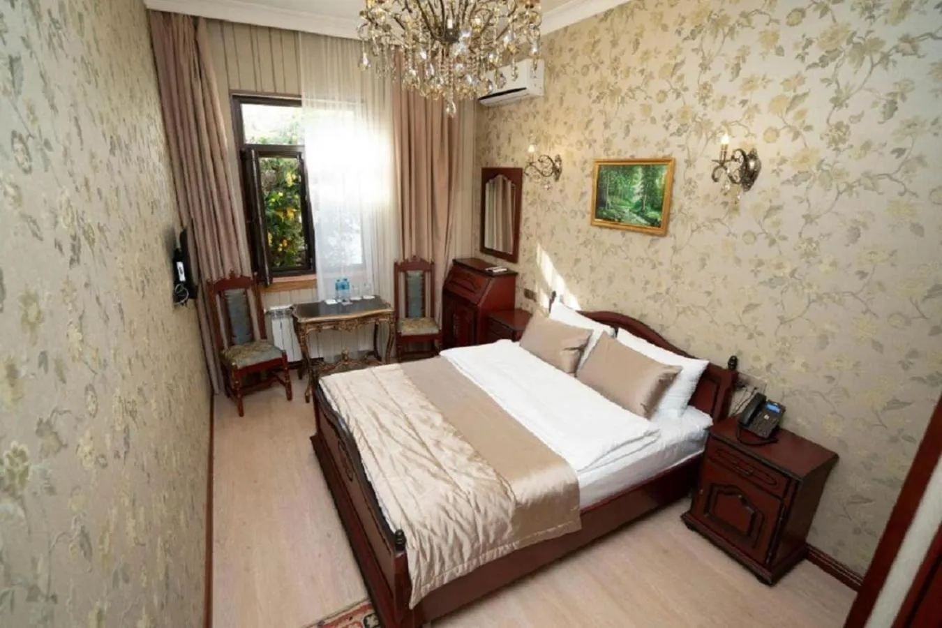 Bed in Royal Antique Boutique Hotel