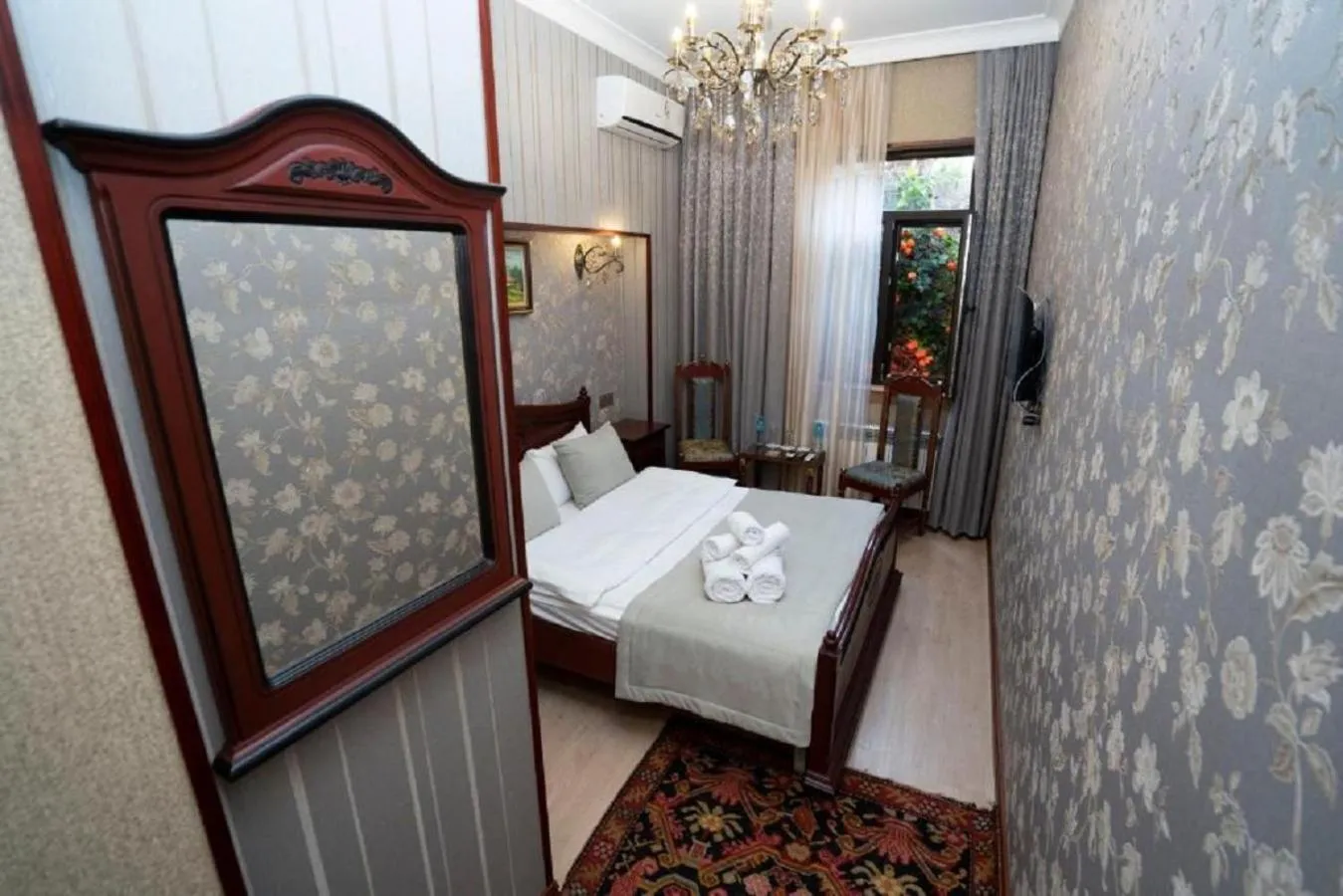 Bed in Royal Antique Boutique Hotel